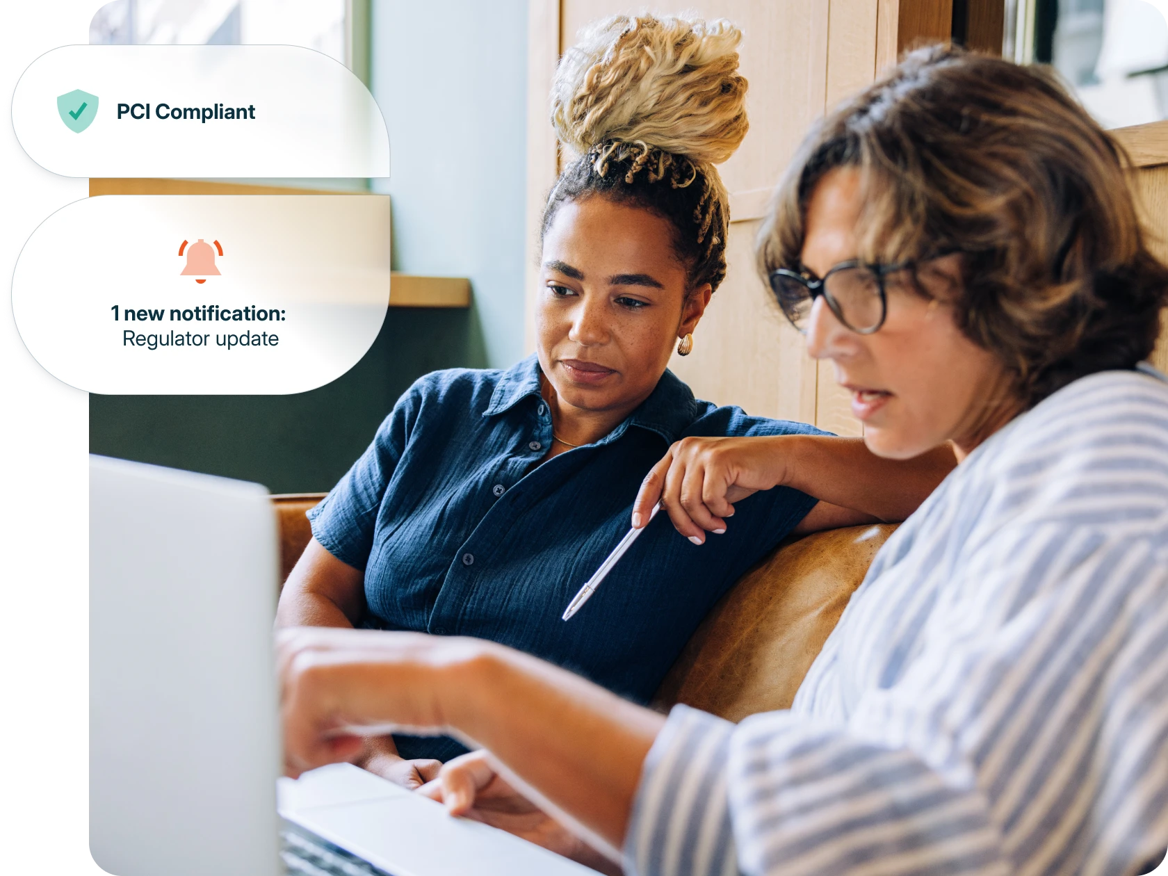 Two people working on laptop with a feature highlight for PCI Compliance.