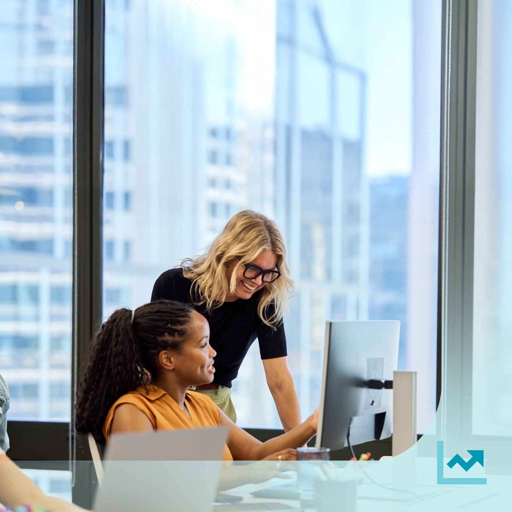 Accountants reviewing profitability on a computer