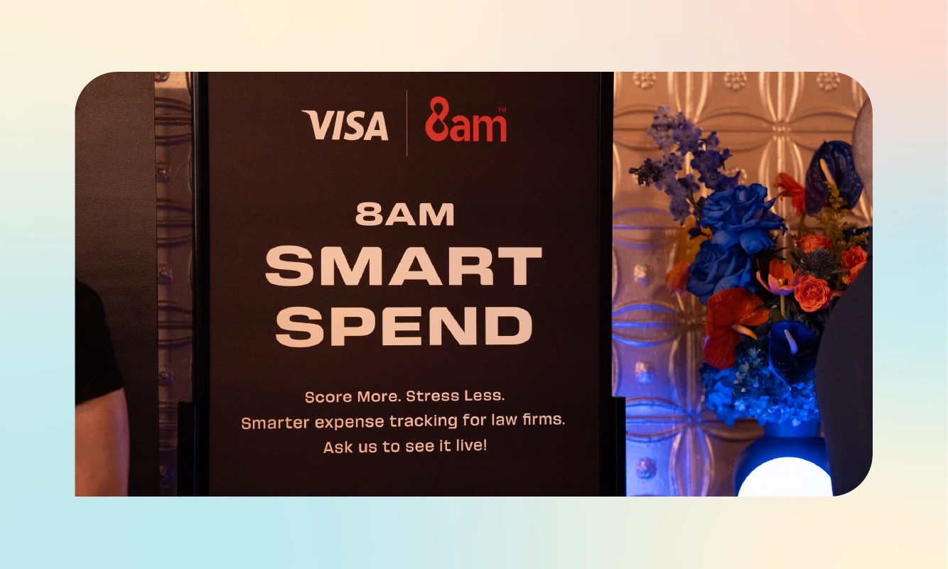 A Visa and 8am Smart Spend signage display promoting smarter expense tracking for law firms, set up at the reception.