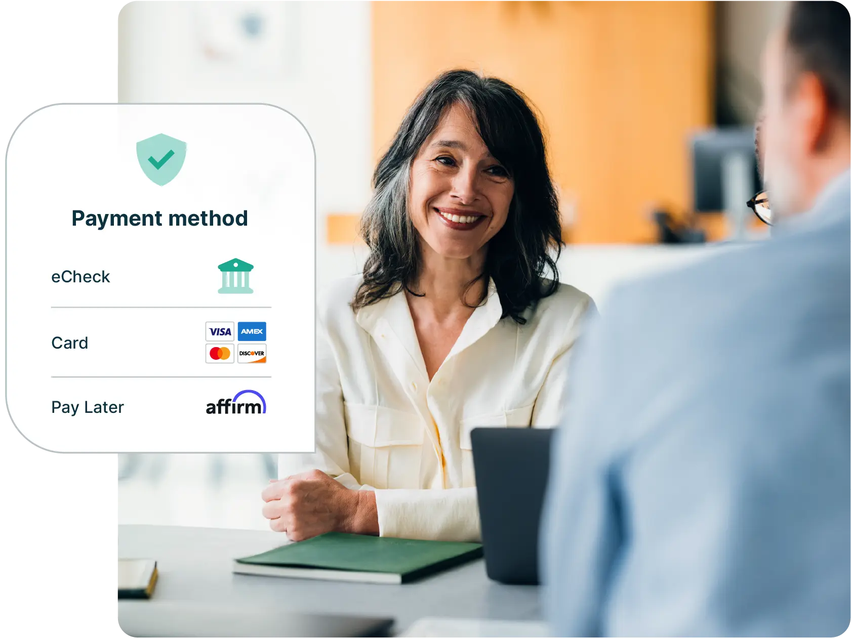 A woman smiles as she discusses the payment methods she can accept - eCheck, Card (Visa, American Express, Mastercard, Discover), Pay Later with Affirm