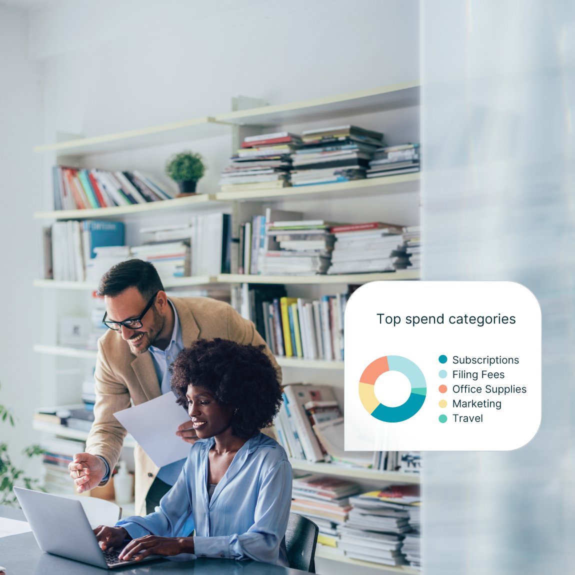 Professional reviewing business spend management dashboard showing budget trends and financial resilience metrics