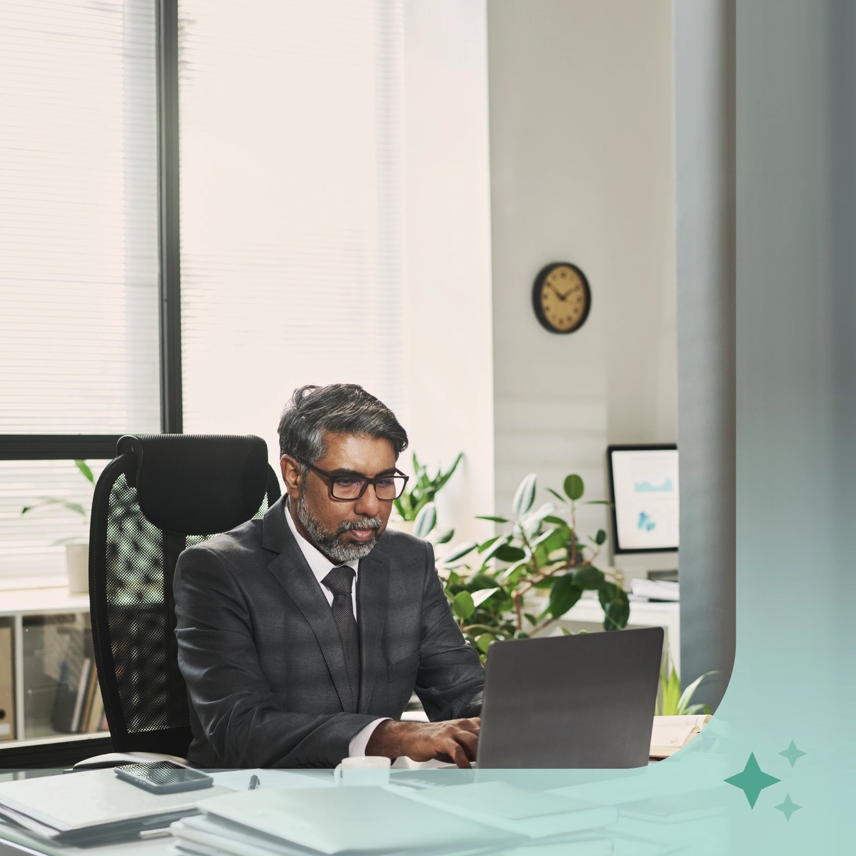 Business professional working at a laptop in a modern office, representing AI and technology in criminal defense law.