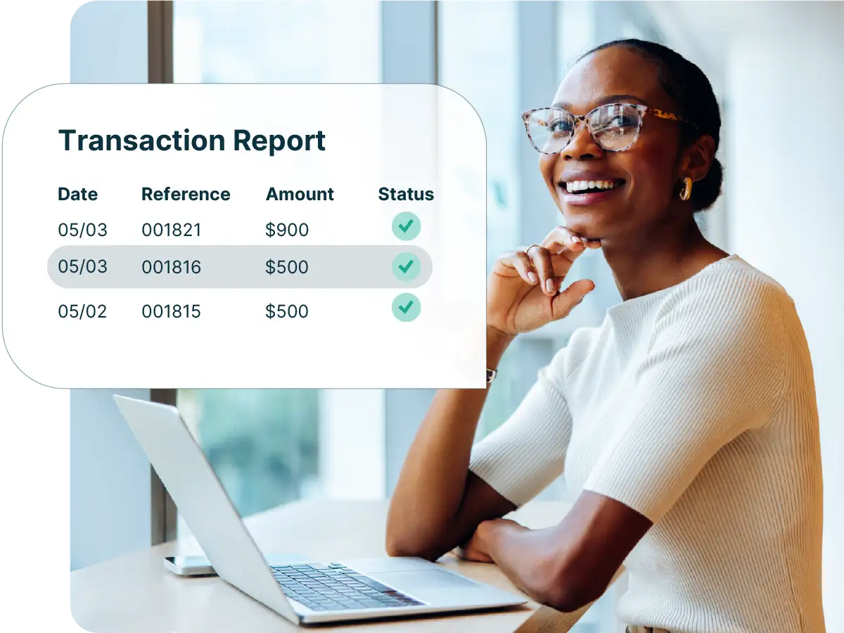 Payment reporting transaction report showing dates, references, amounts, and status while a professional reviews completed payments on a laptop.