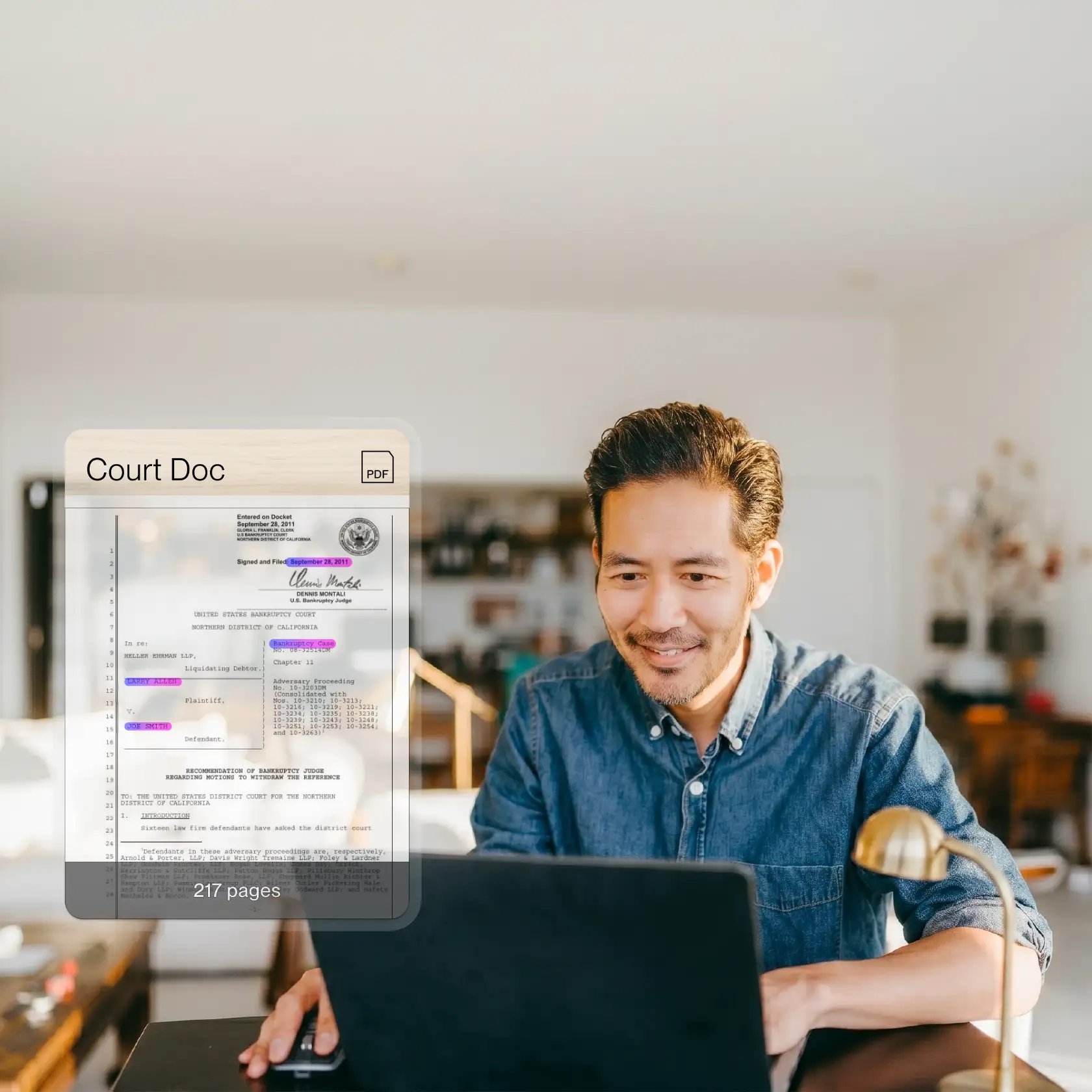 Man sitting at a computer reviewing a court document