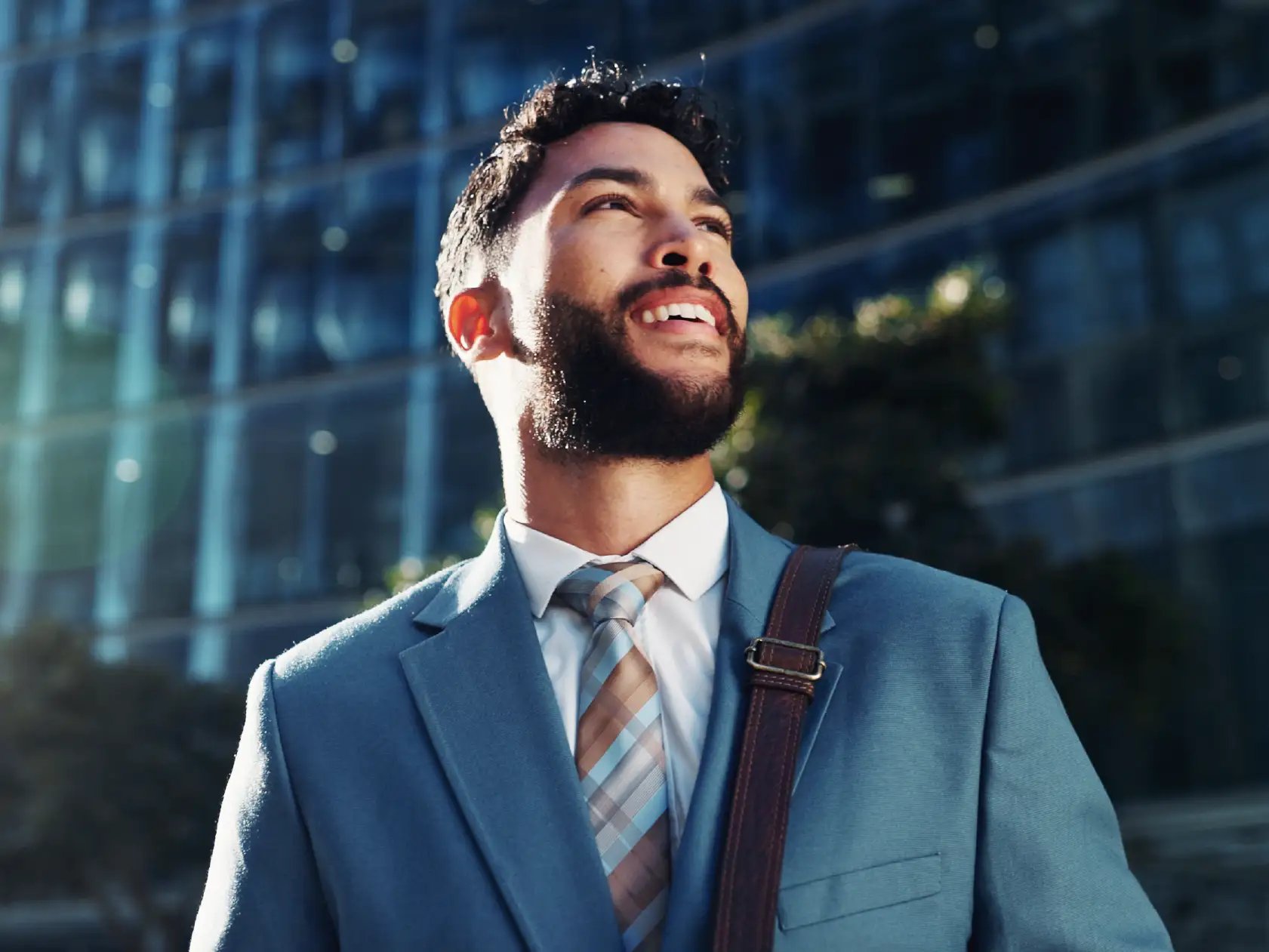 business professional standing in front of building