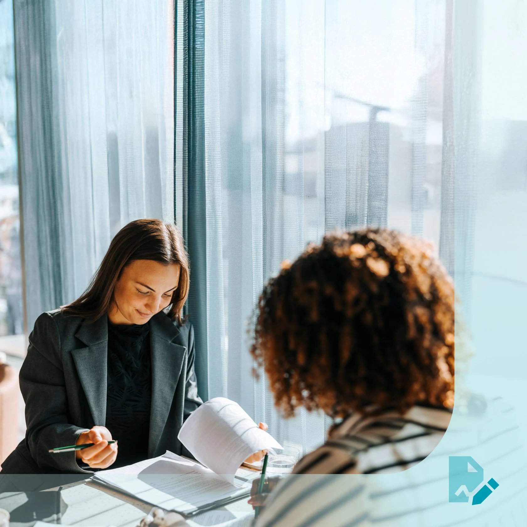 Lawyer reviewing paperwork with client