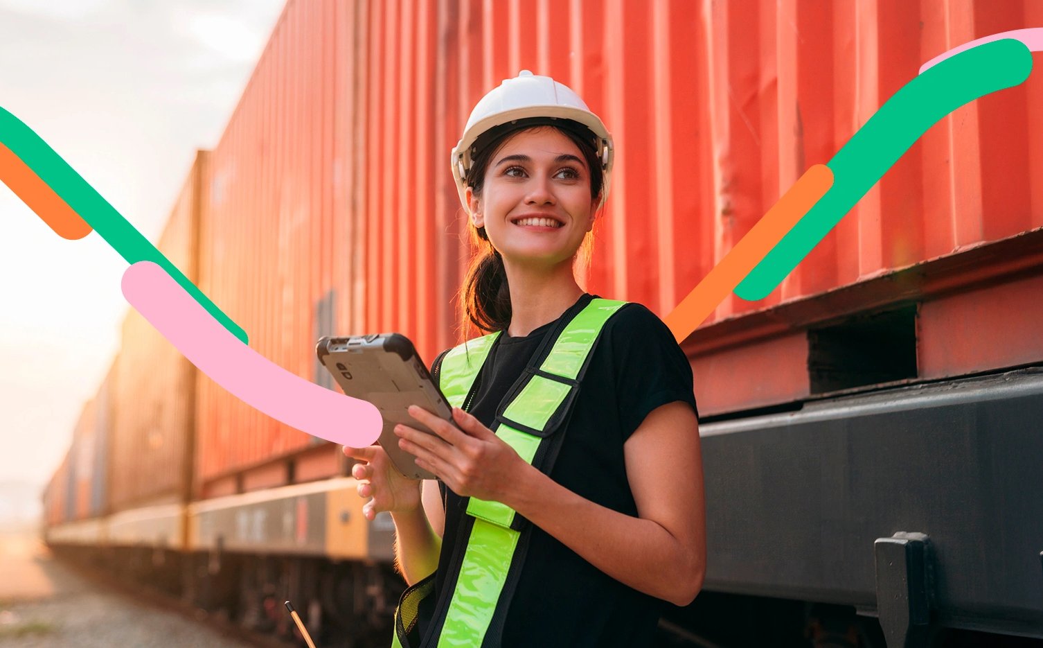 Persona al lado de un vagón de carga revisa en su tableta sus cobranzas de importación para pagar sus compras en el exterior.