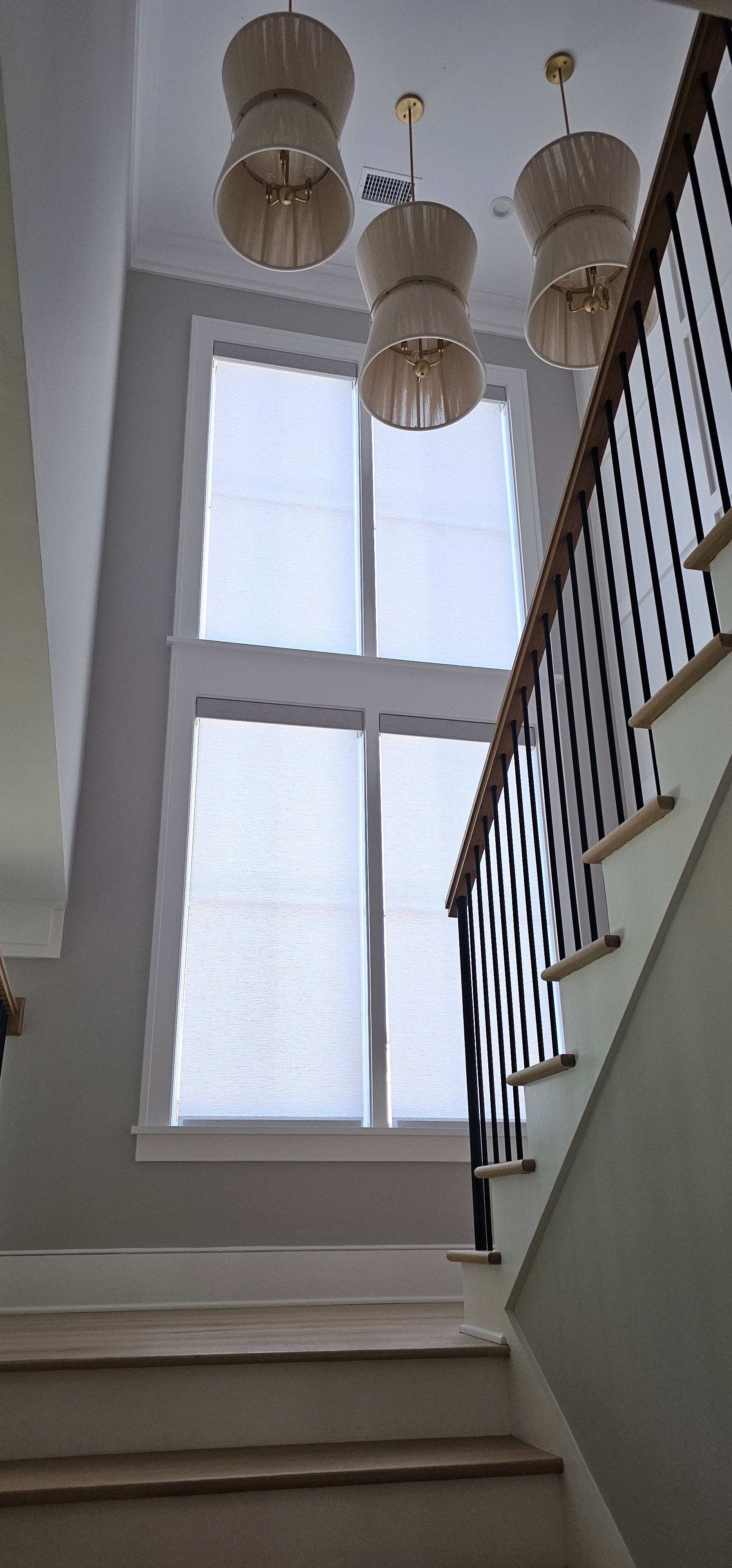 shades-roller-white-staircase-tall-double-windows