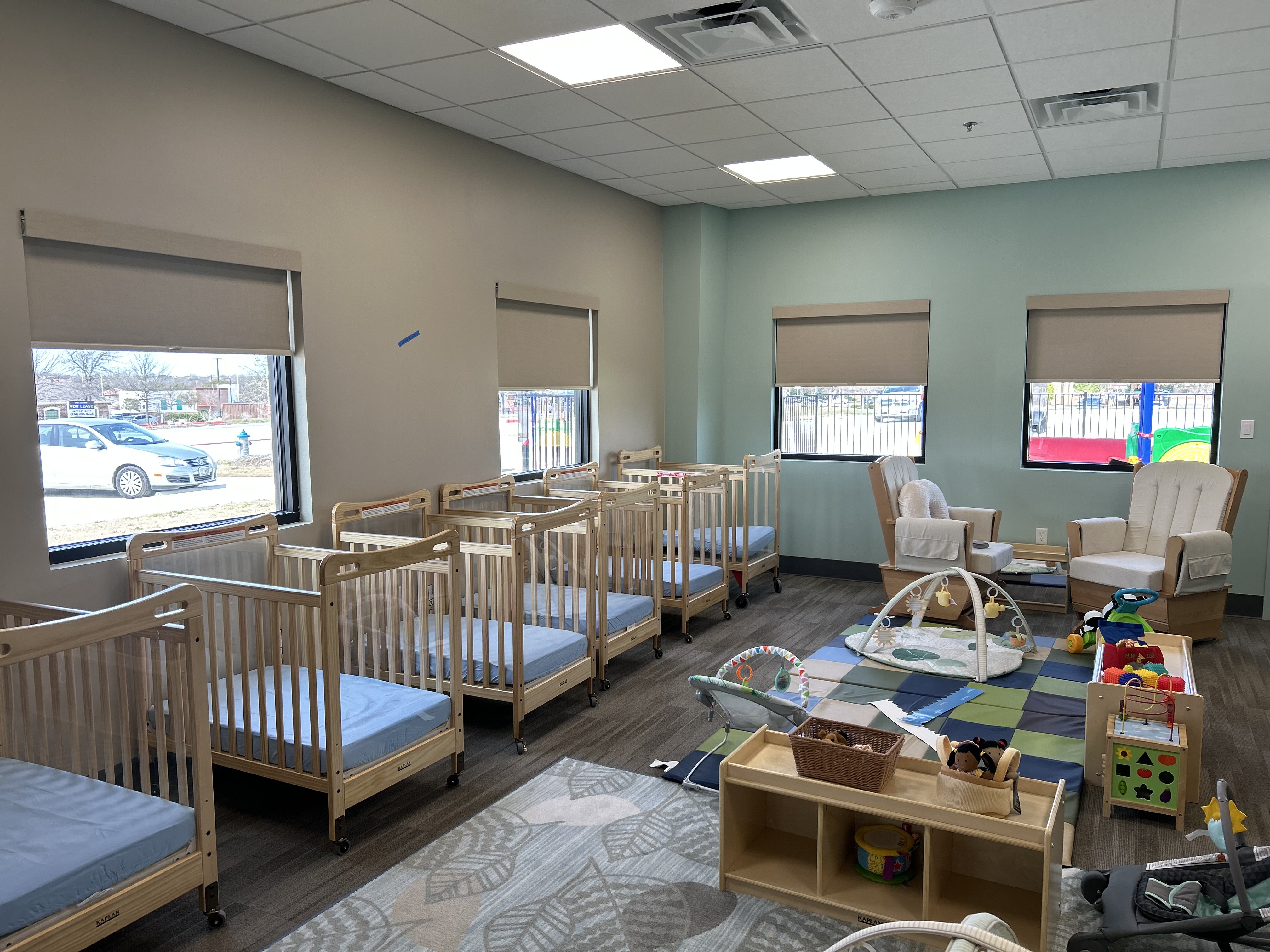 Cordless roller shades in daycare windows