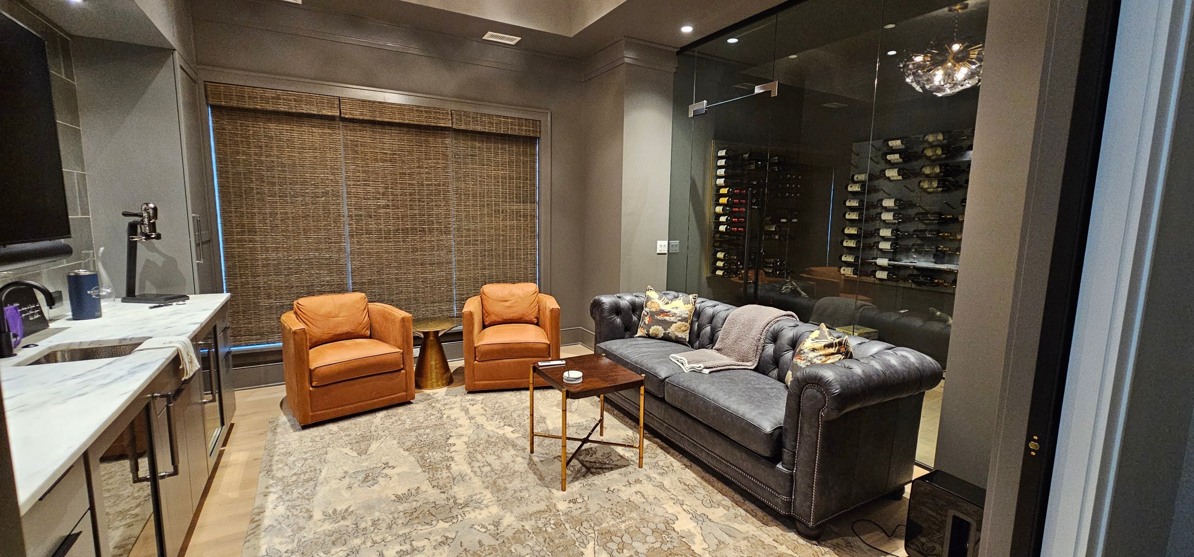 shades-woovenwood-motorized-light-brown-wine-room-living room-after