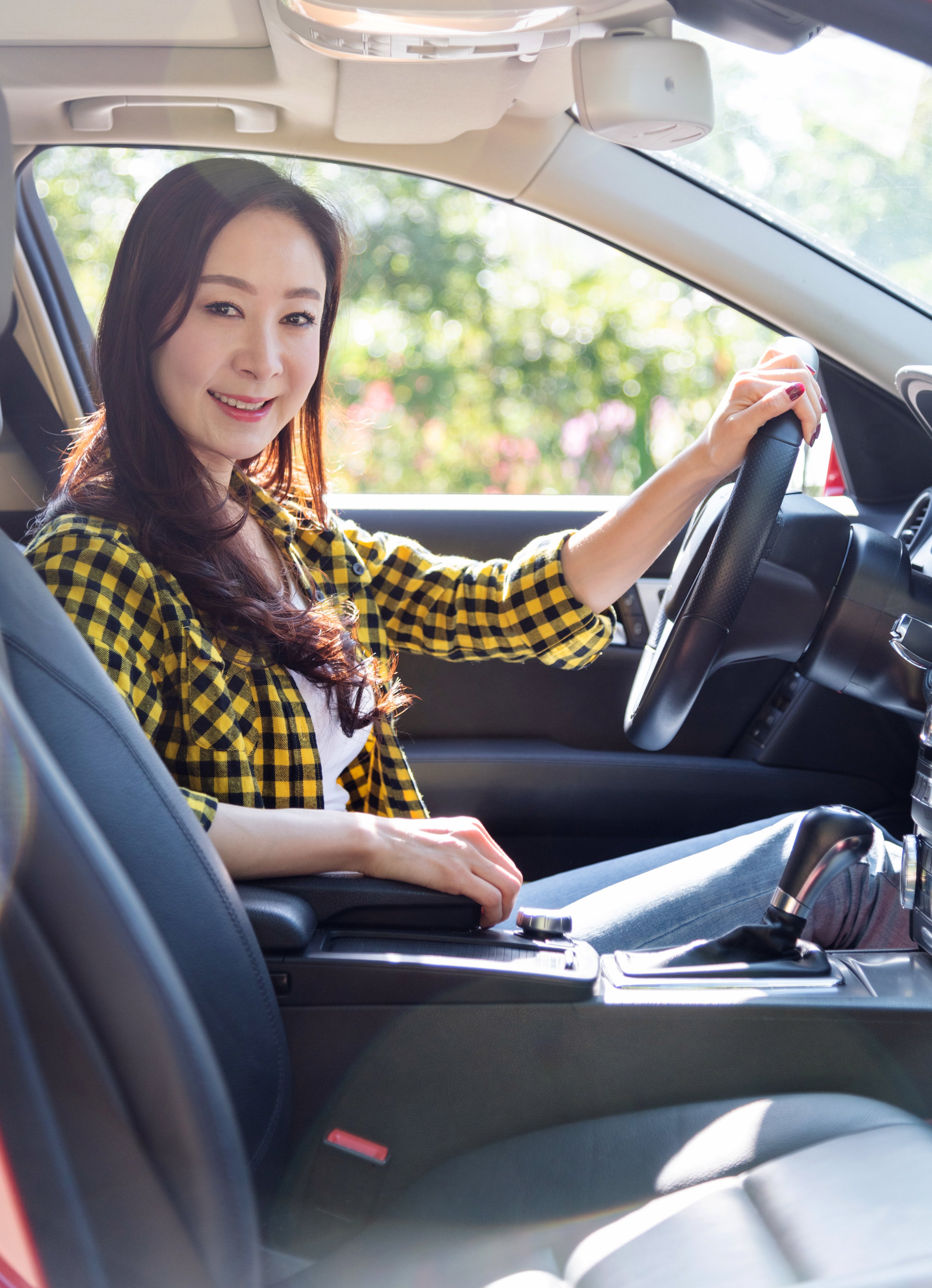 Smiling woman driving in a car