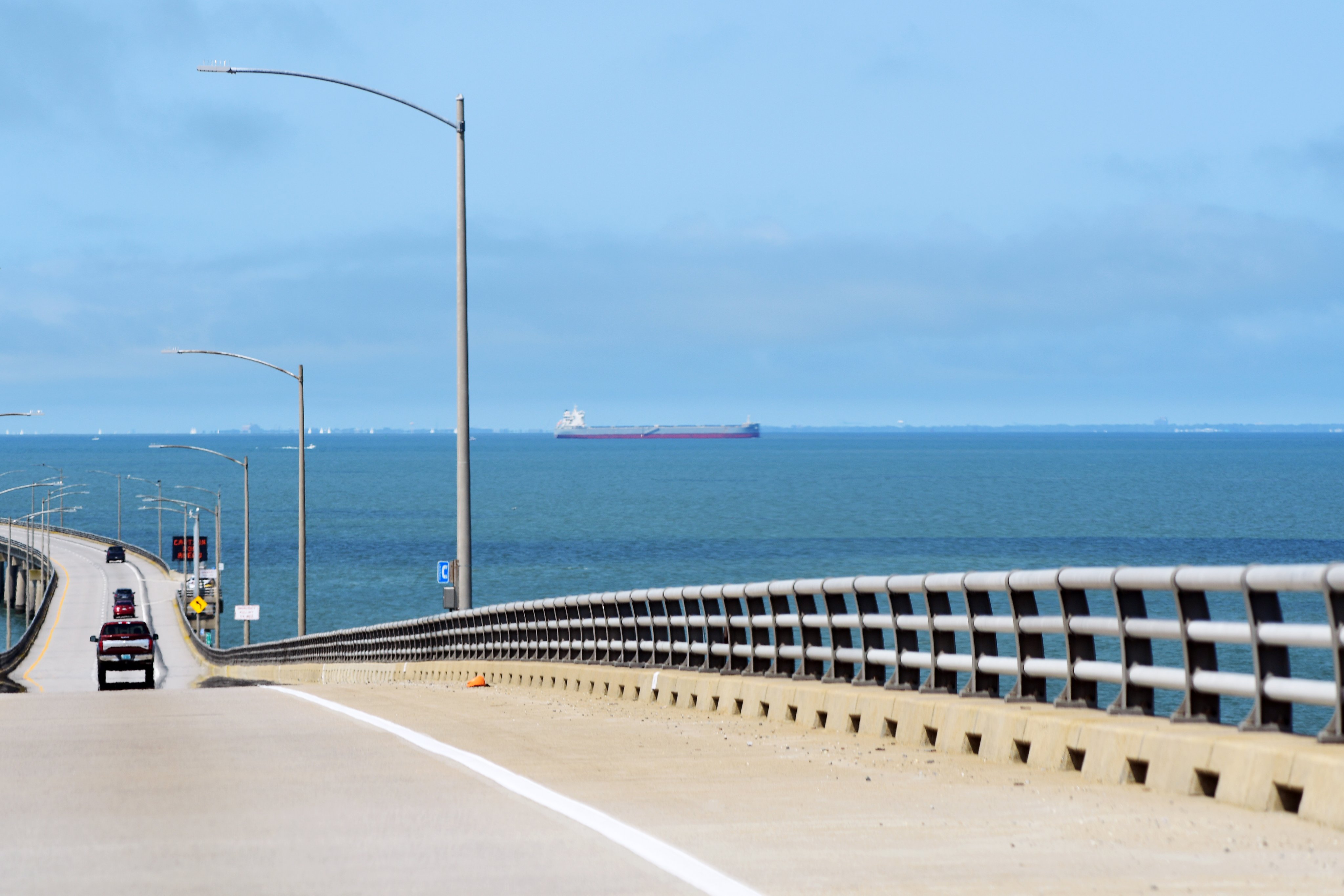 Cars driving through the Chesapeake Bay Bridge Tunnel that connects rural eastern Virginia to urban western Virginia