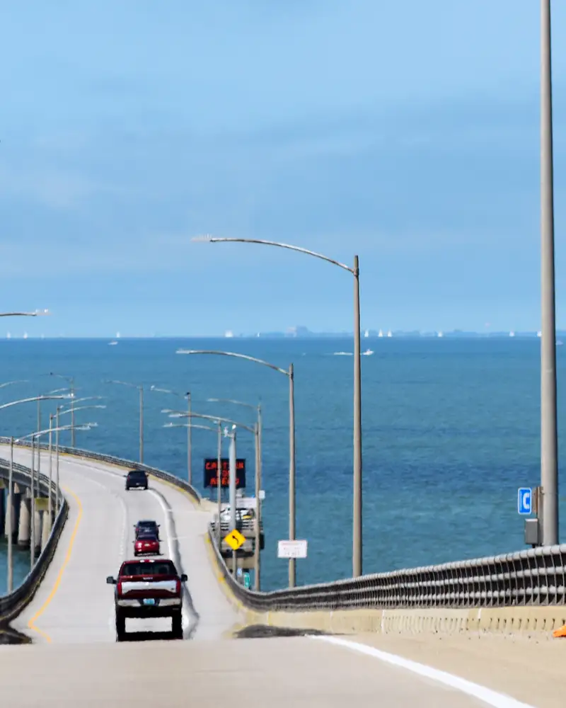 Cars driving through the Chesapeake Bay Bridge Tunnel that connects rural eastern Virginia to urban western Virginia