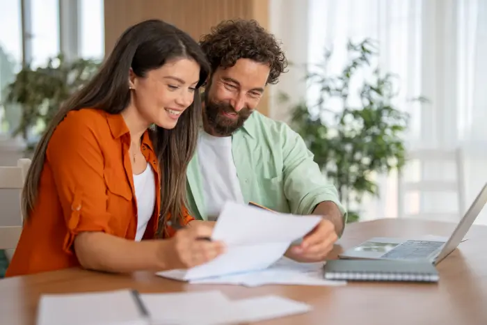 Couple managing their homeowners insurance coverage