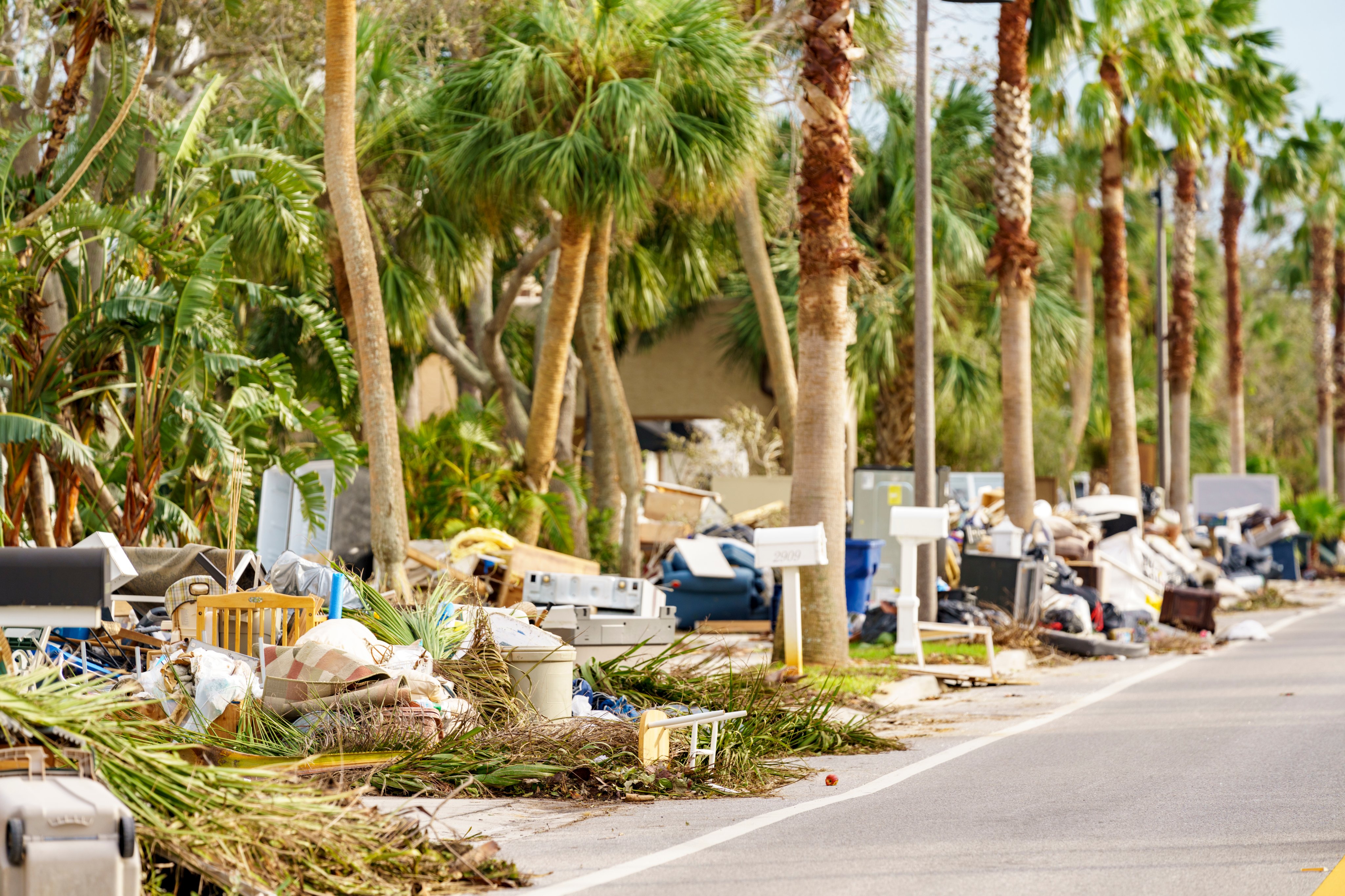 Home owners leaving piles of damaged furniture on the street after Hurricane Milton storm surge St Petersburg Beach