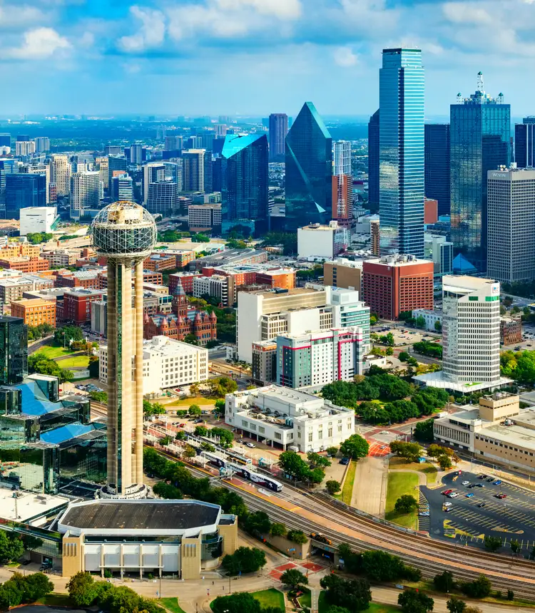 The beautiful modern skyline of Dallas, Texas shot aerially from an altitude of about 800 feet.
