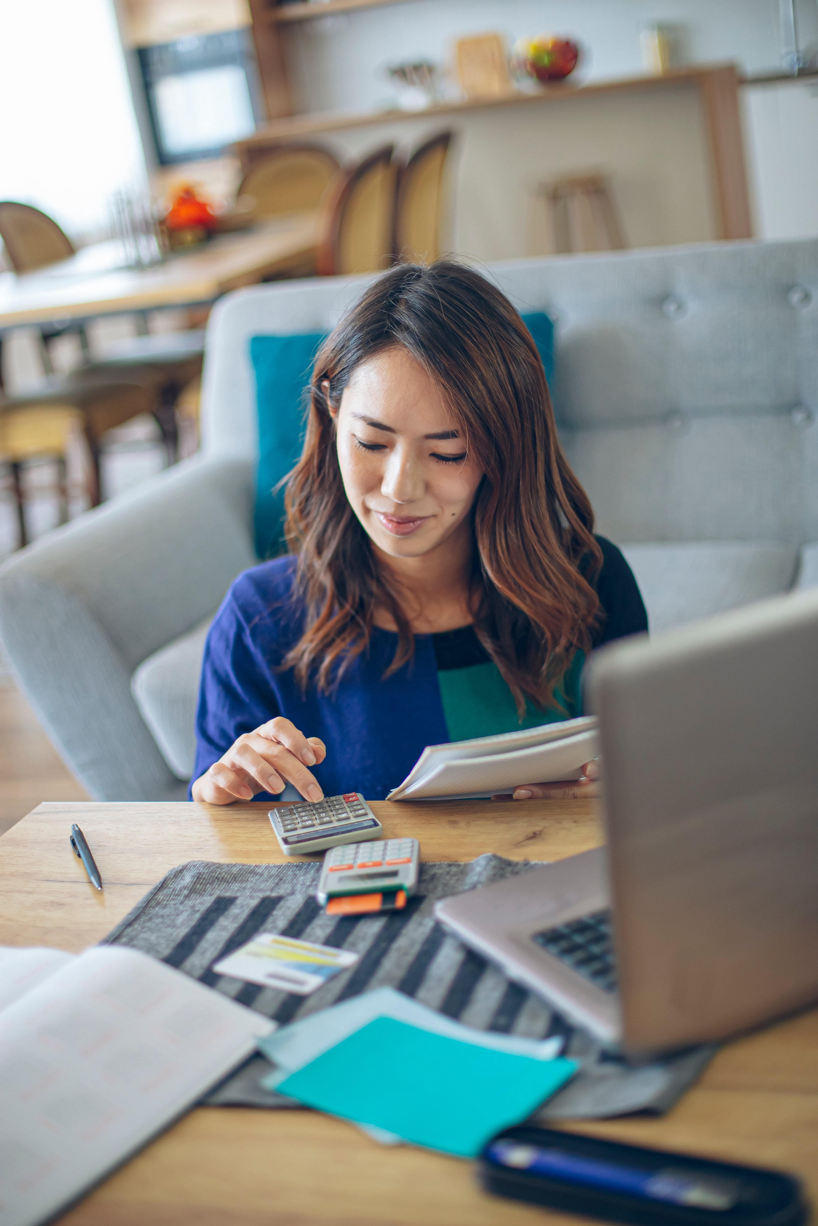 Asian woman doing financial planning at her home