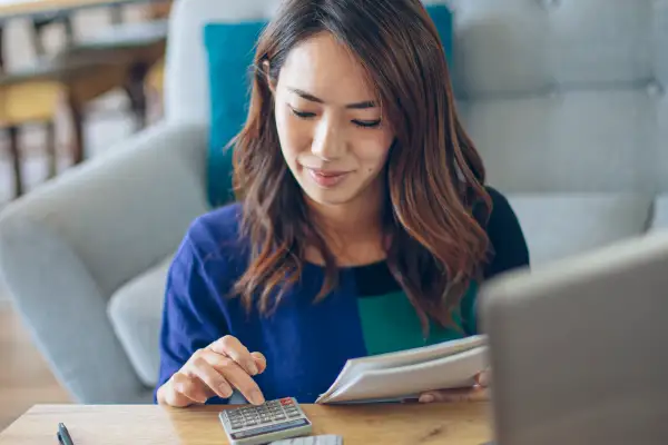 Asian woman doing financial planning at her home