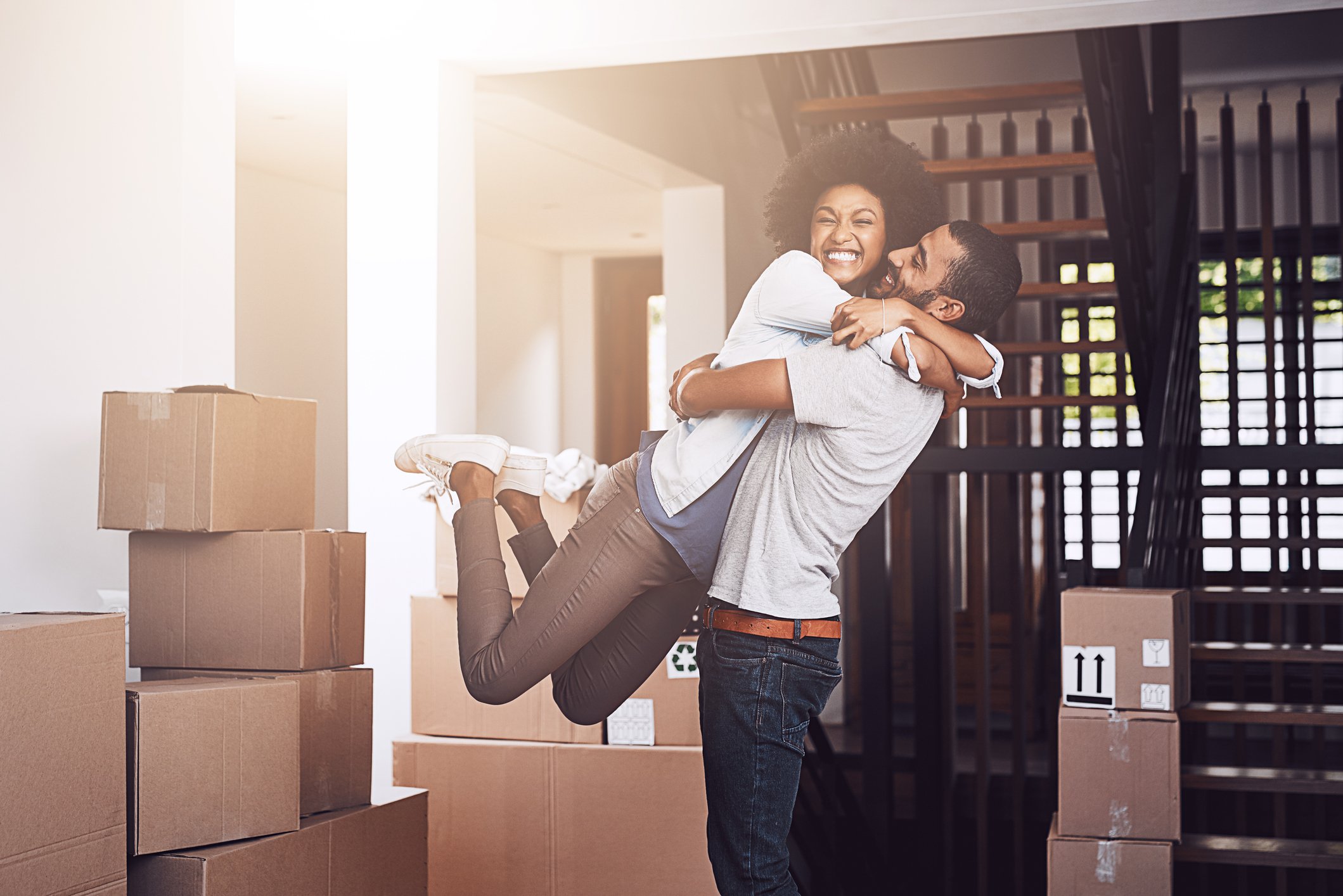 Happy couple hugging in new home