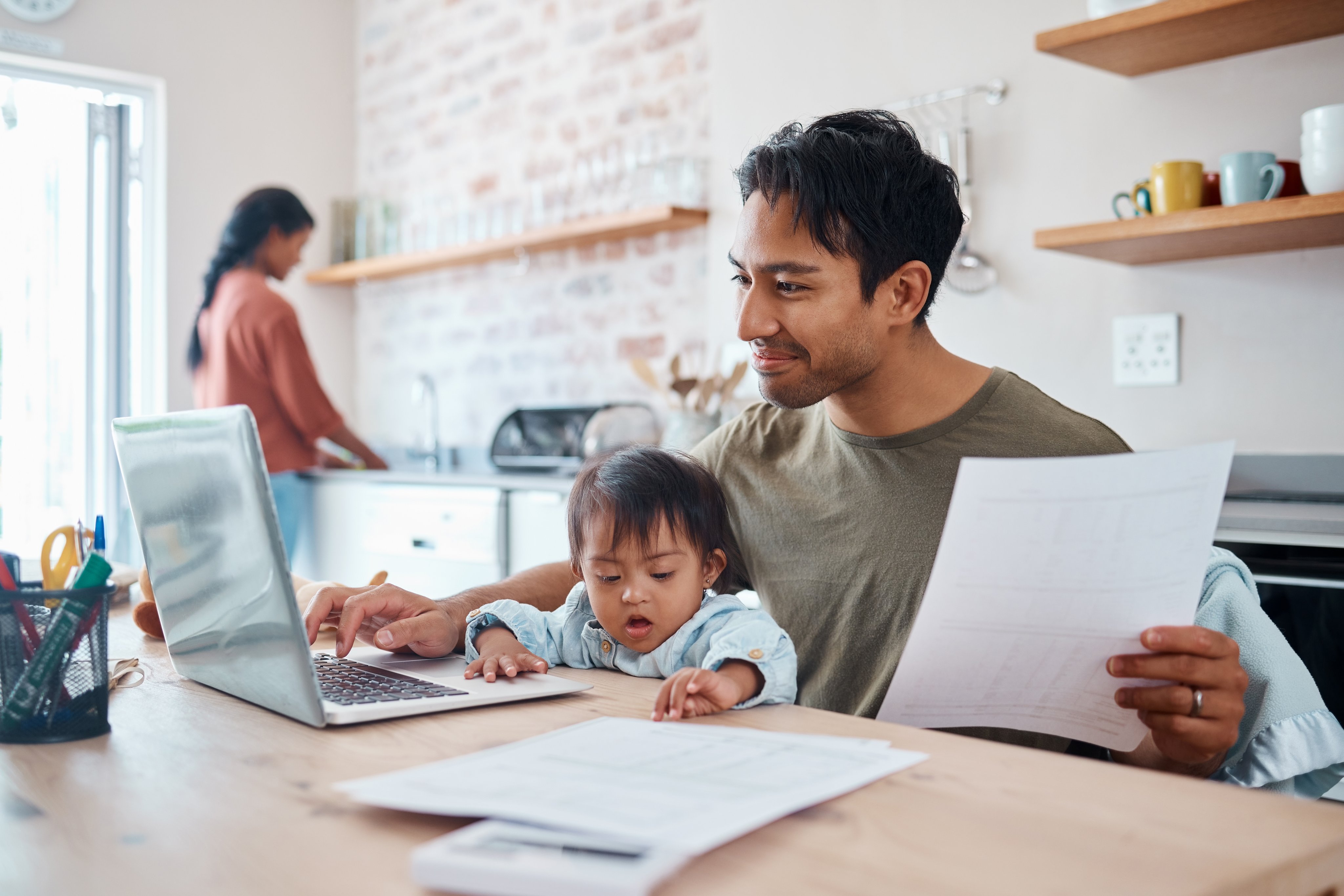 Man, baby or laptop finance in house or home kitchen and insurance paper, investment documents or fintech accounting software