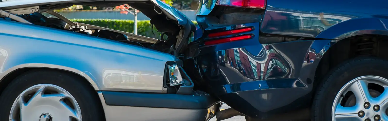 Auto accident involving two cars on a city street