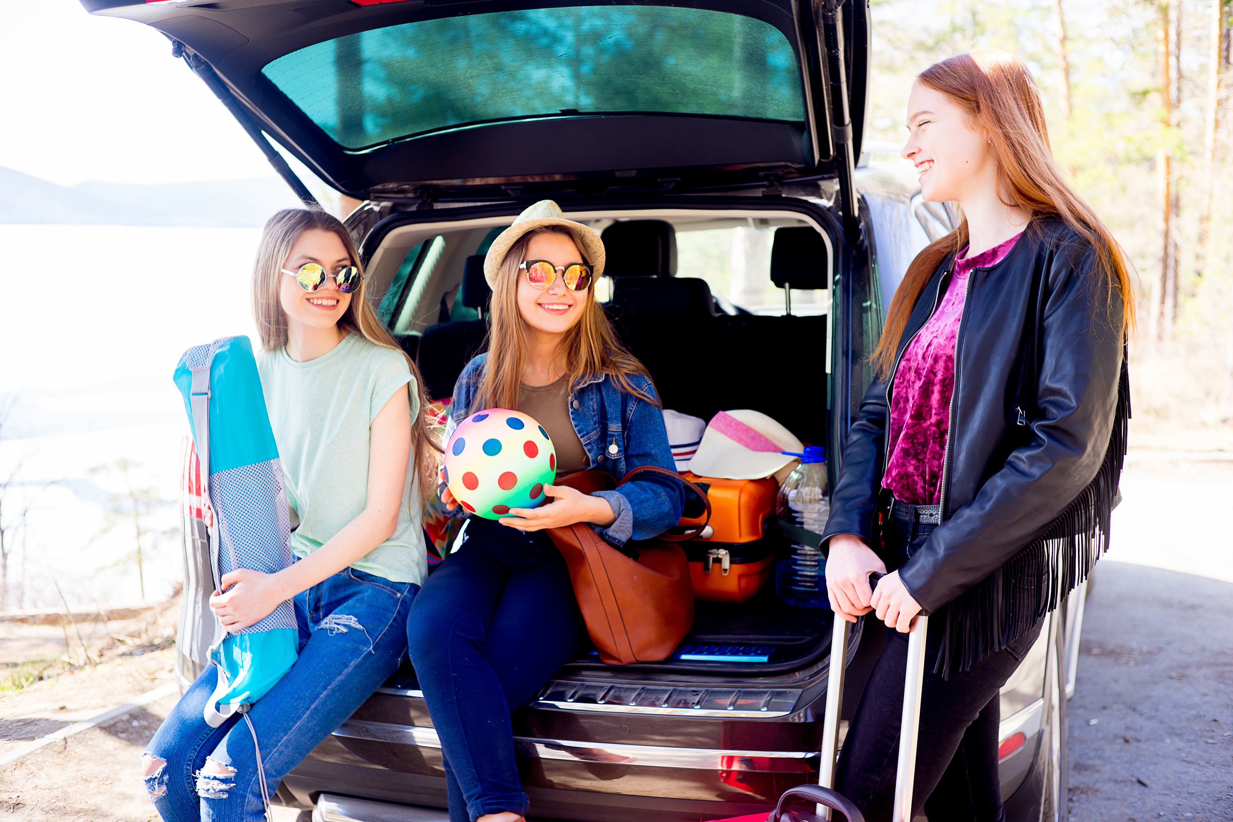 Three girls packed up for a road trip