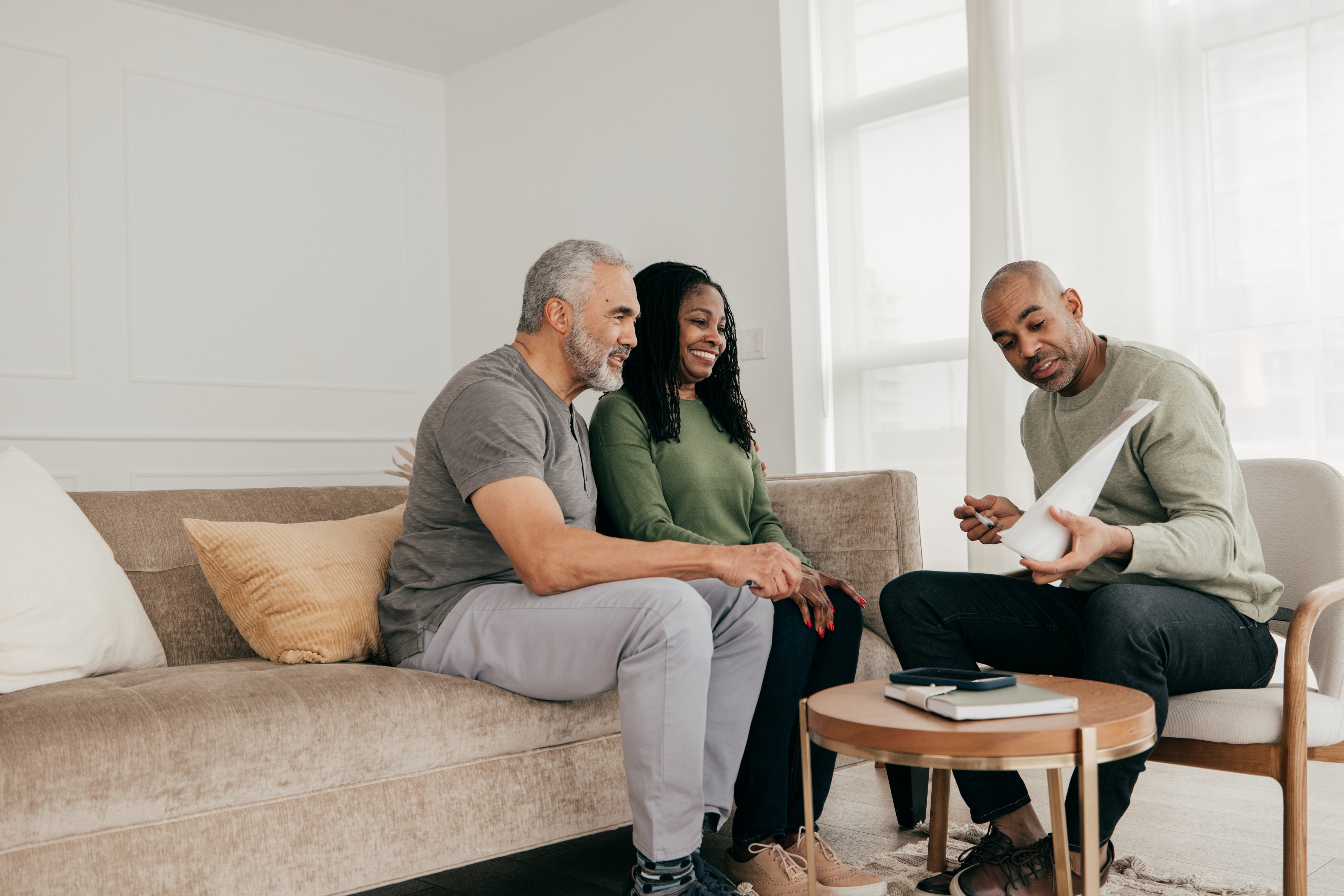Homeowners meeting with an insurance broker