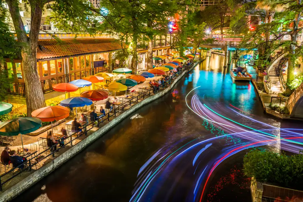 San Antonio Riverwalk along scenic river canal at night
