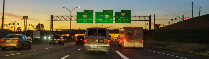 Traffic travelling on the I-35 through San Antonio at sunset