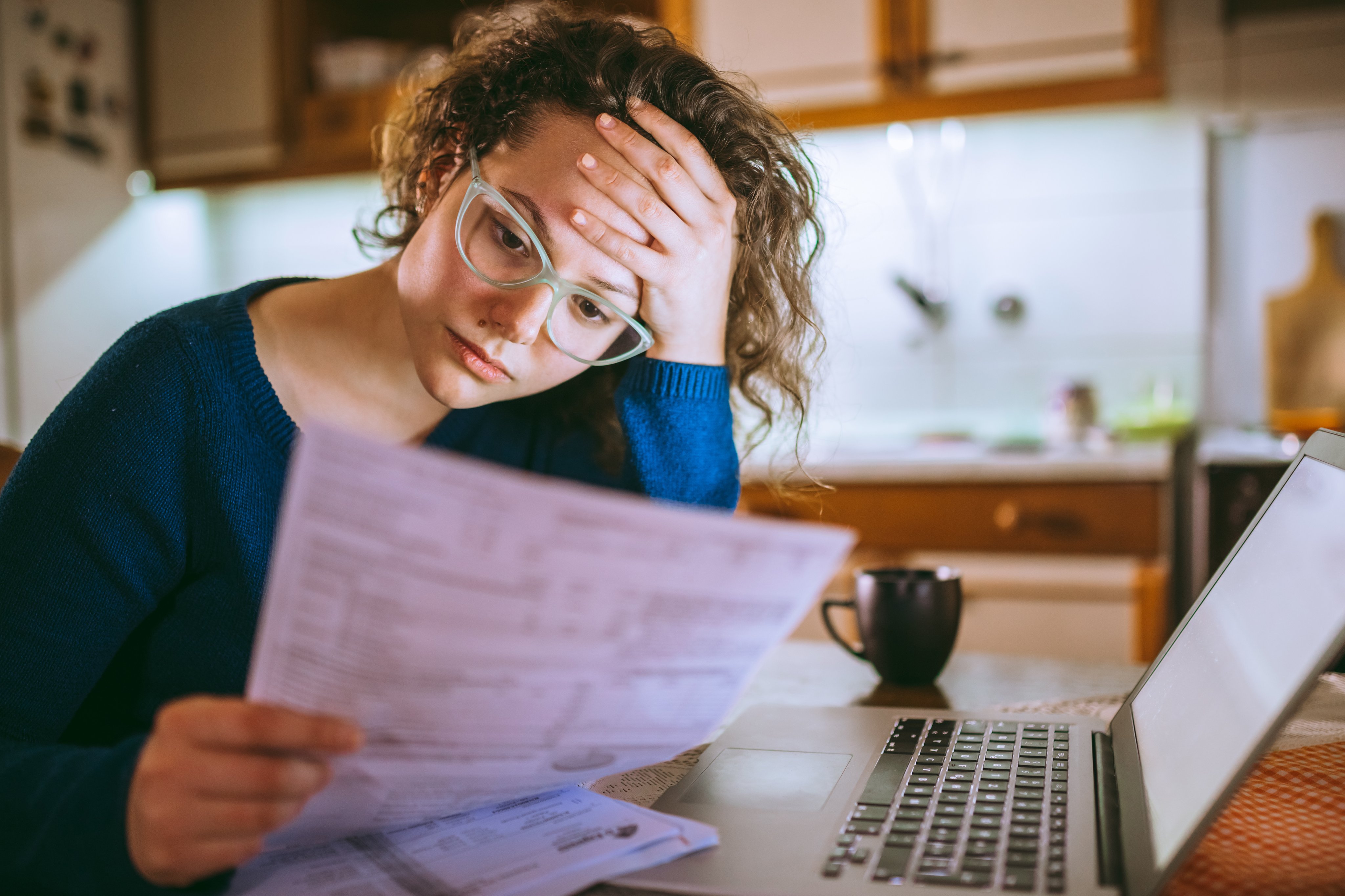 Woman reviewing policy paperwork.