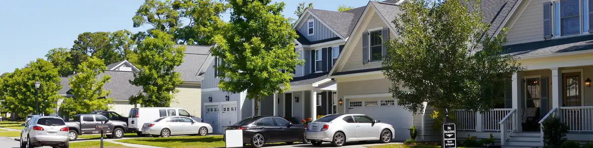 A row of newly built upscale luxury homes on a well landscaped street in Savannah, Georgia, USA.