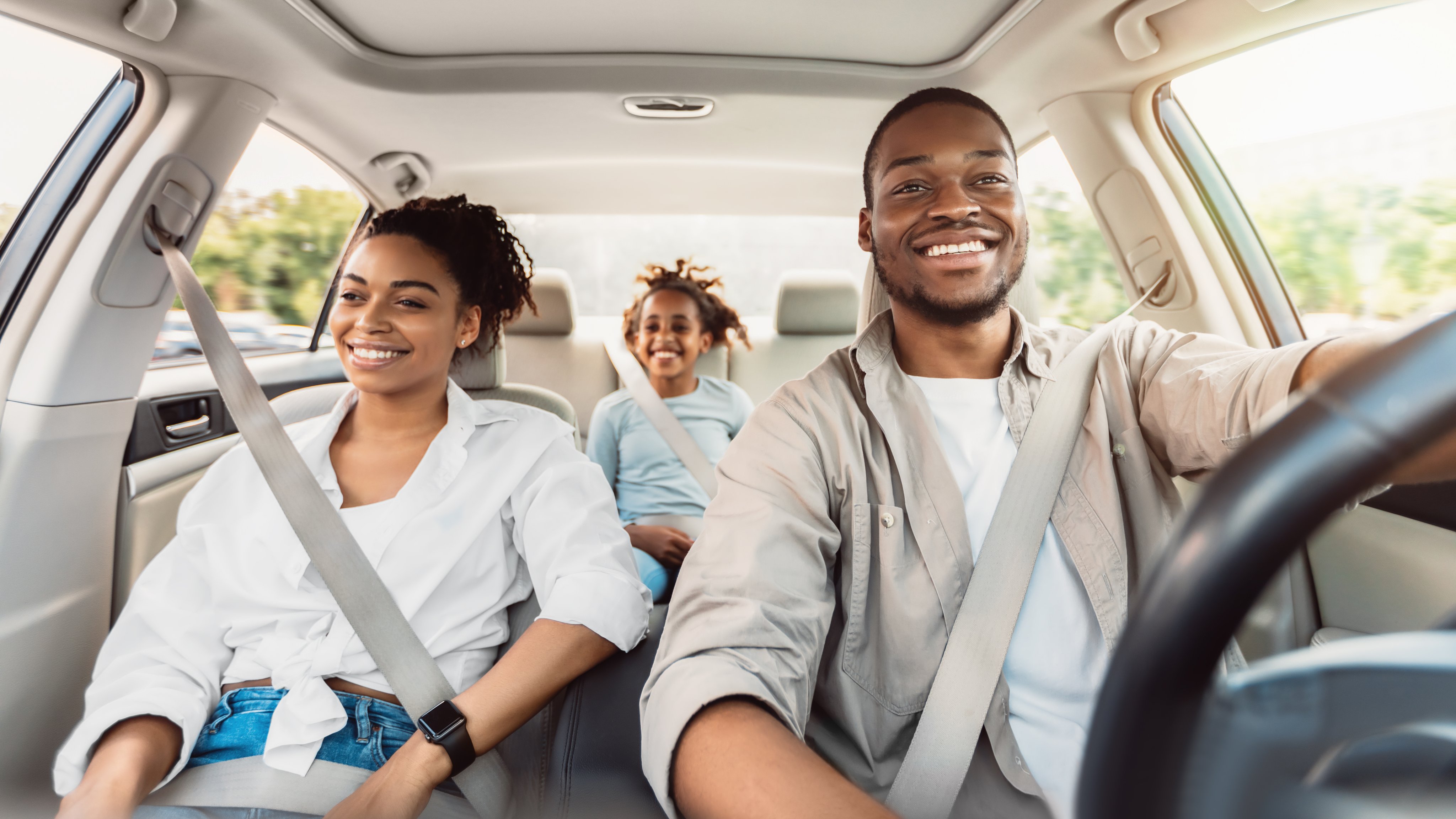 Happy African American Family Riding Car Traveling By Automobile.