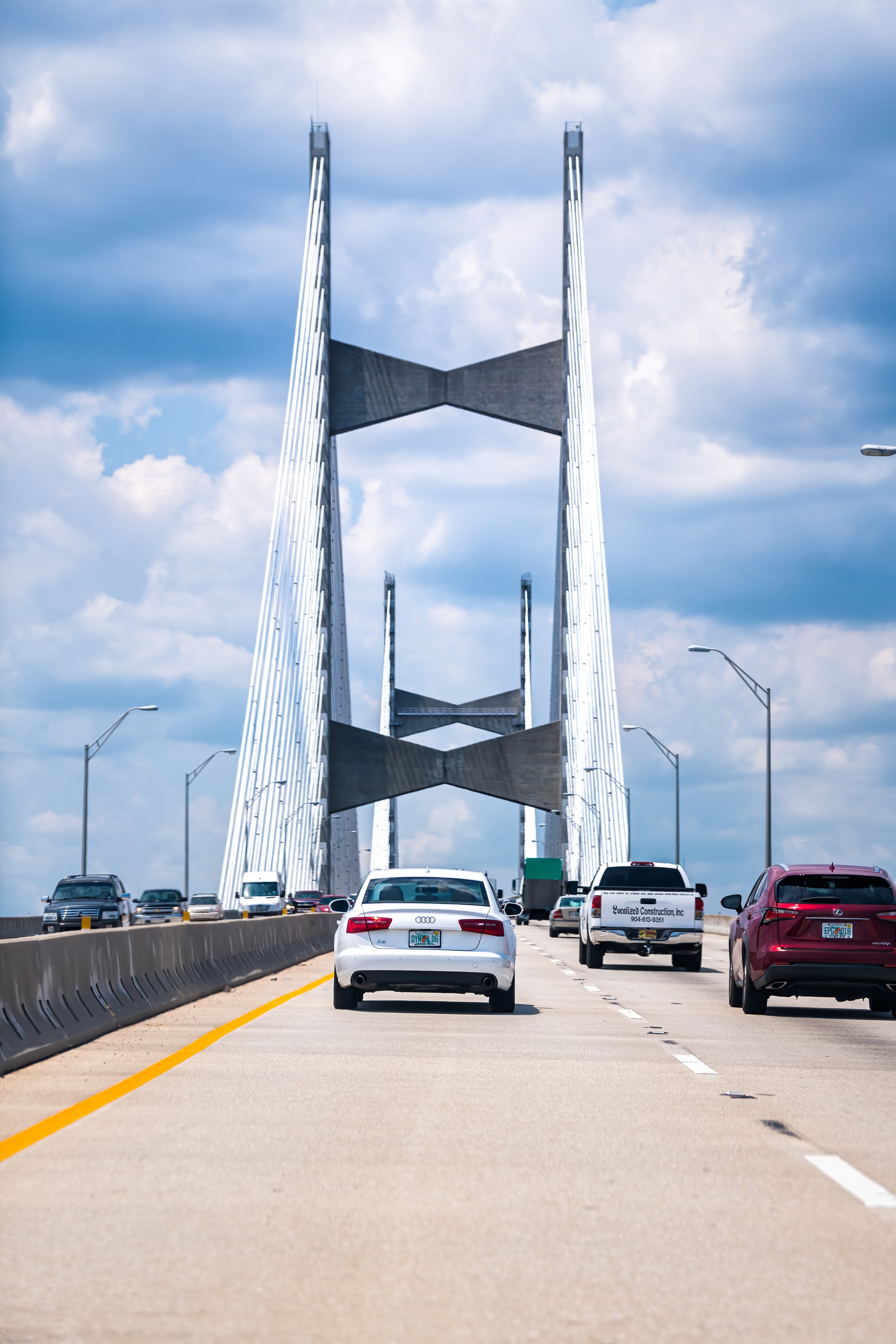 Cars on Dames Point or Napoleon Bonaparte Broward suspension cable-stayed bridge over St. Johns River in Florida Interstate 295 East Beltway