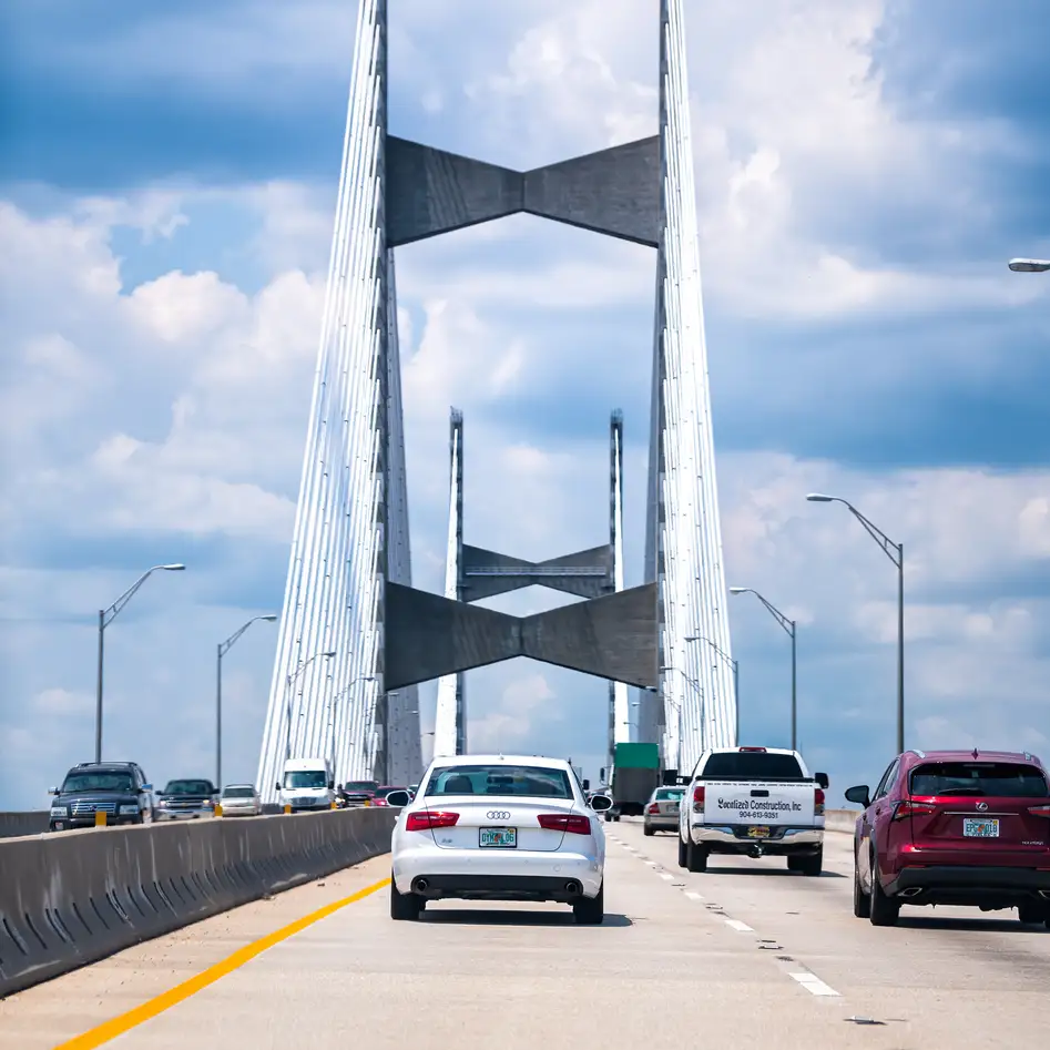 Cars on Dames Point or Napoleon Bonaparte Broward suspension cable-stayed bridge over St. Johns River in Florida Interstate 295 East Beltway