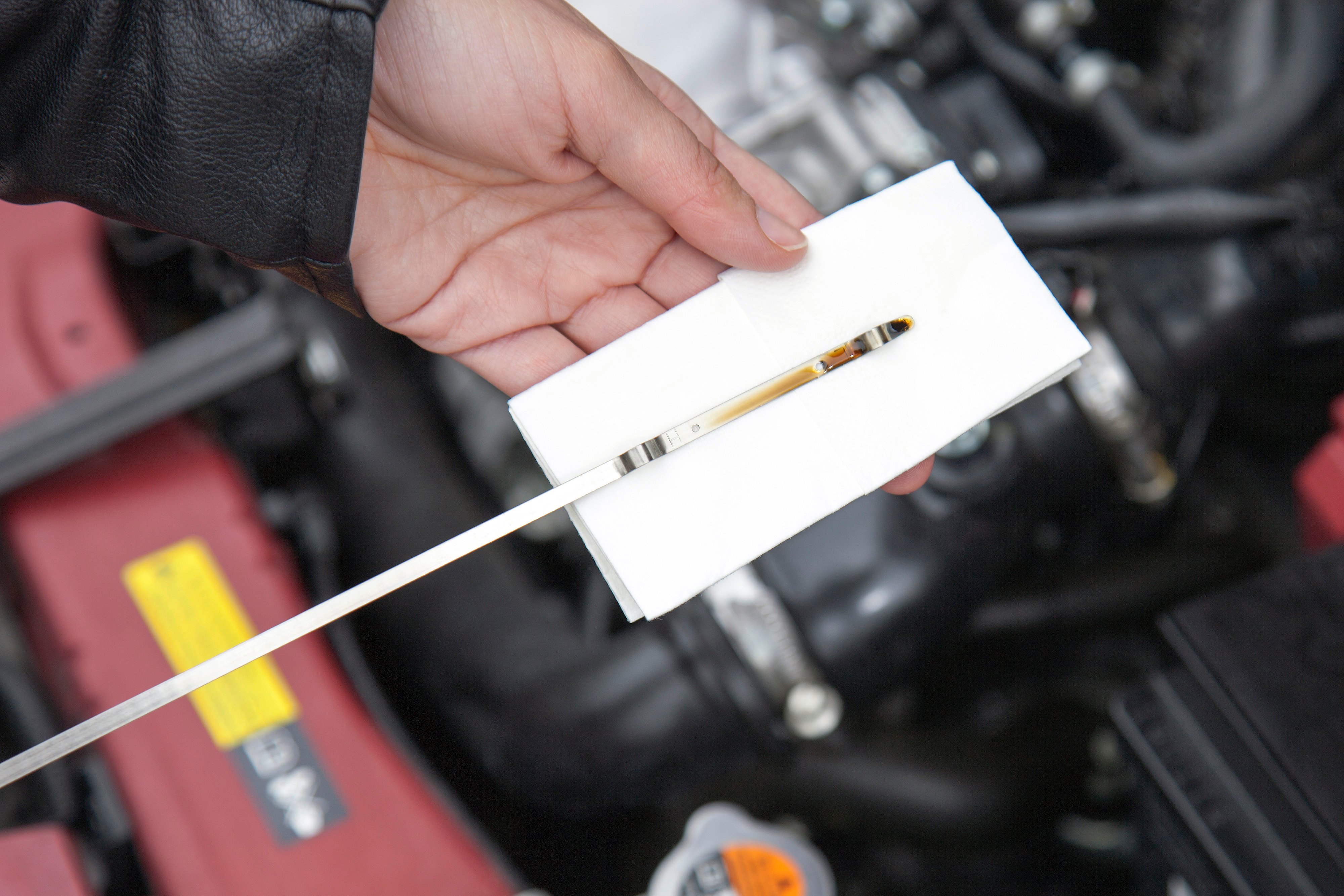 Close up shot of a car motor oil deep-stick