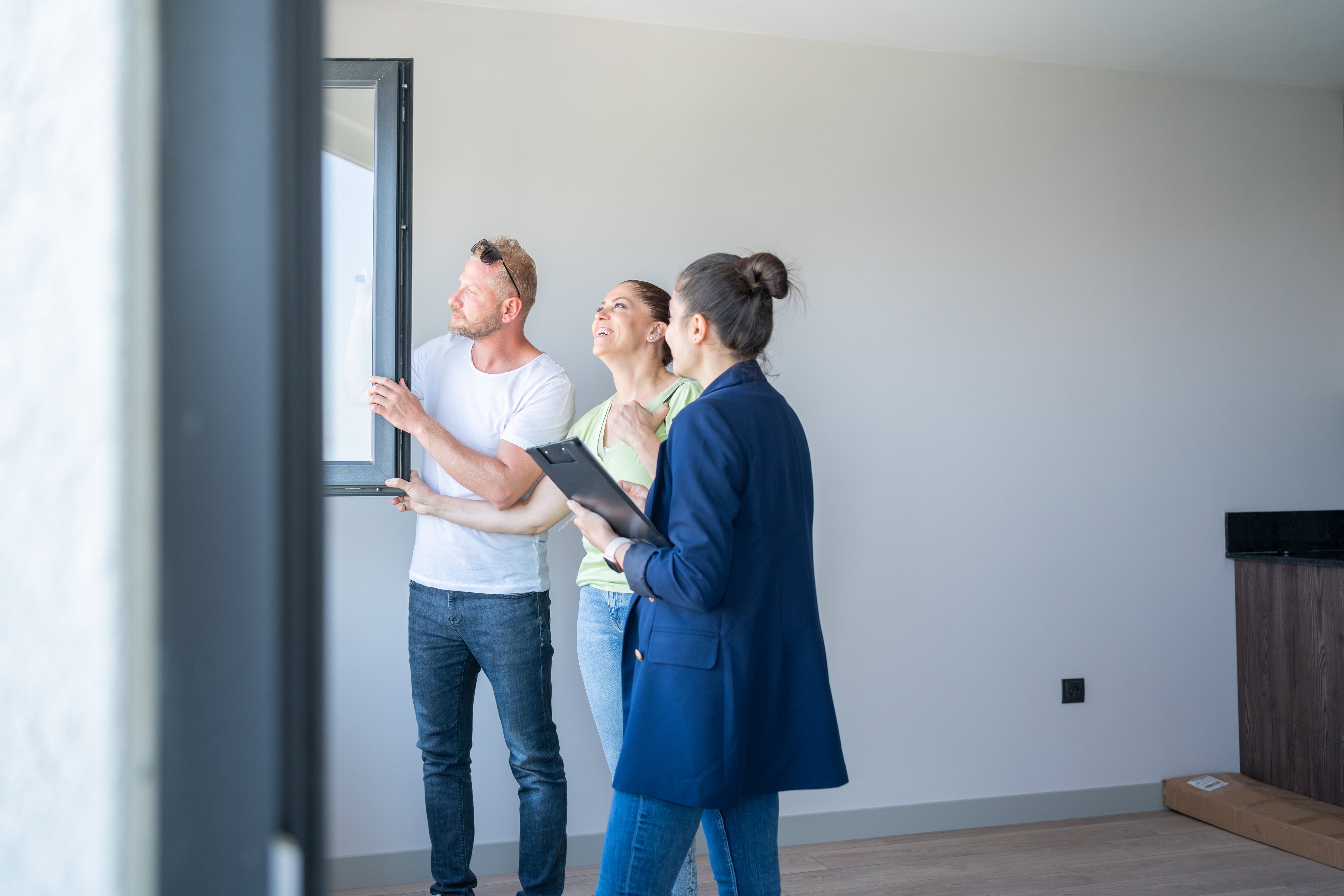 Real estate agent showing property to family