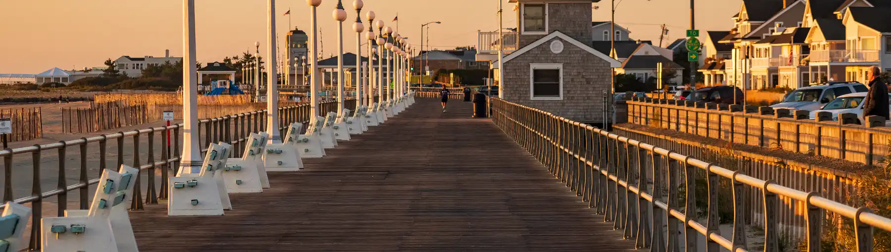 Avon By the Sea, New Jersey, USA - Golden hour sunrise on the jersey shore boardwalk in Avon by the Sea New Jersey