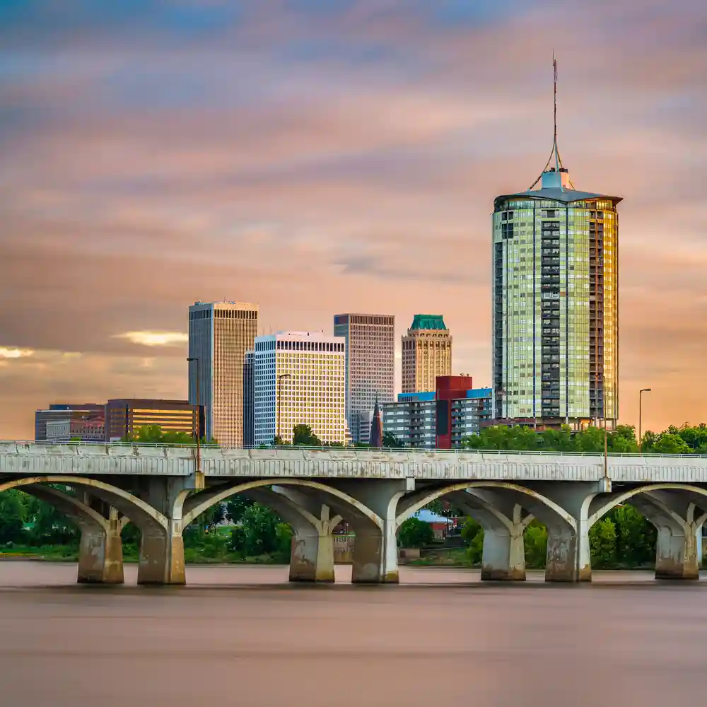 Tulsa, Oklahoma, USA downtown skyline on the Arkansas River at dusk.