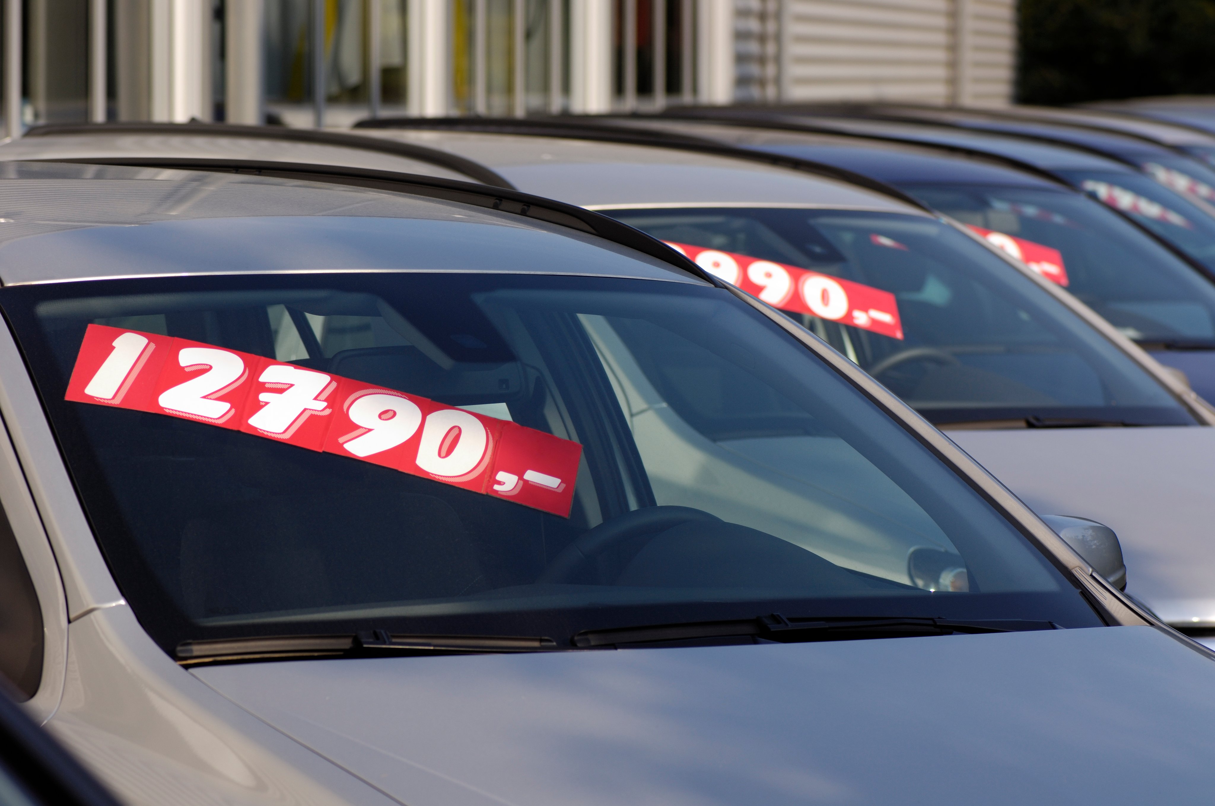 Row of used car with prices