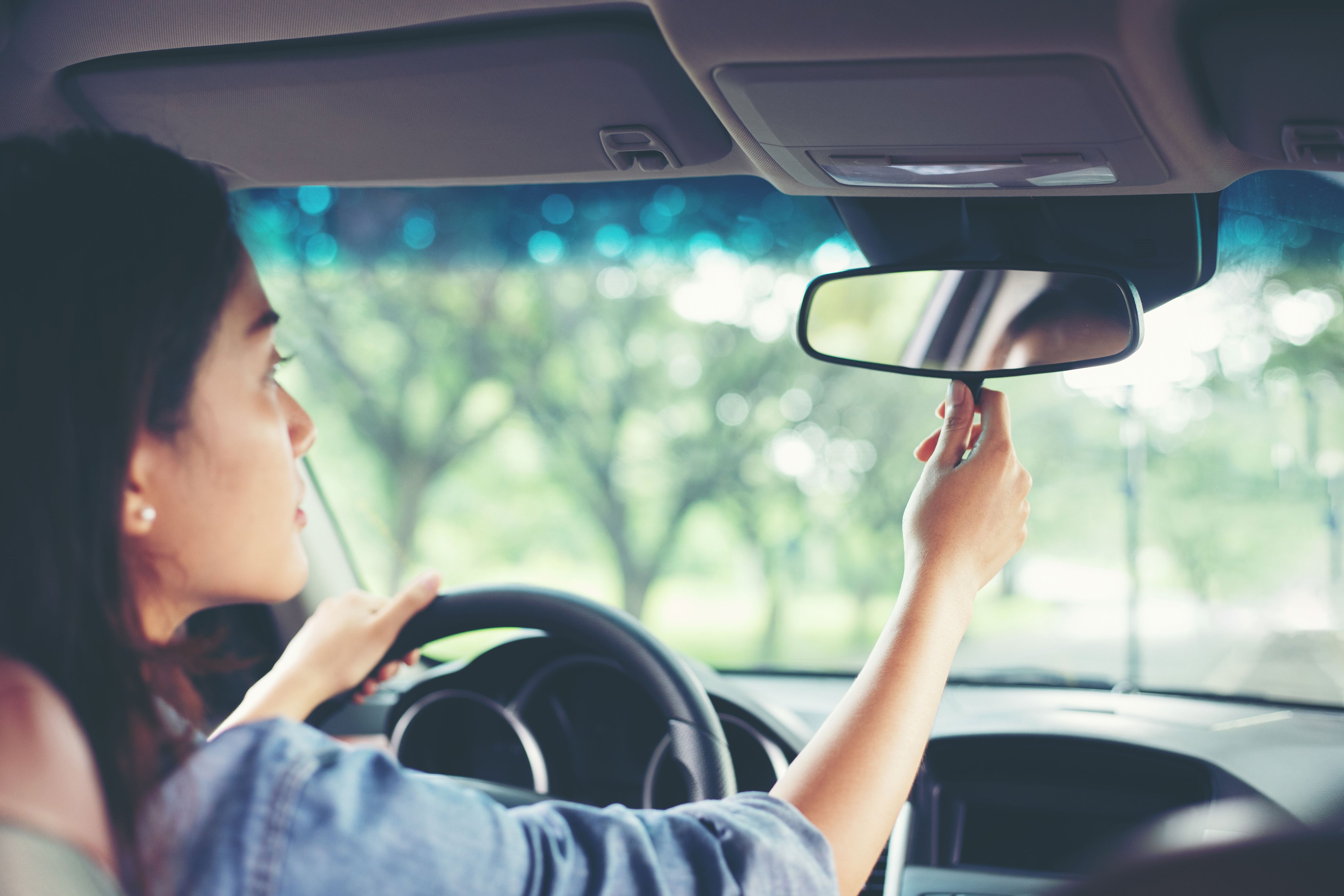 Teen driver checking mirrors