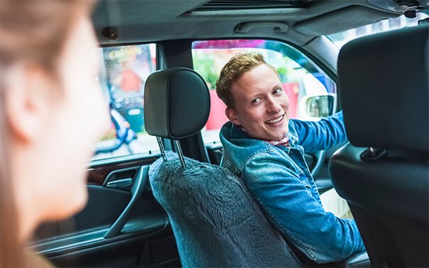 Ride share driver talking to customer