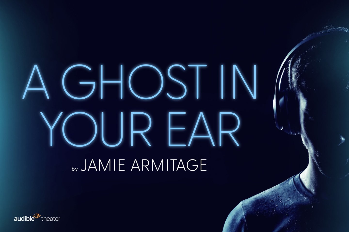 Dark image shows the glowing text “A GHOST IN YOUR EAR by JAMIE ARMITAGE” with part of a person’s face, wearing headphones, visible on the right. Audible Theater logo appears in the bottom left corner.
