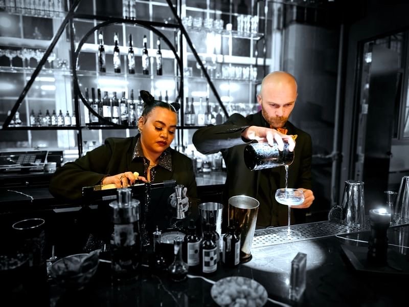 Bitter Monk, bartenders behind the stick.