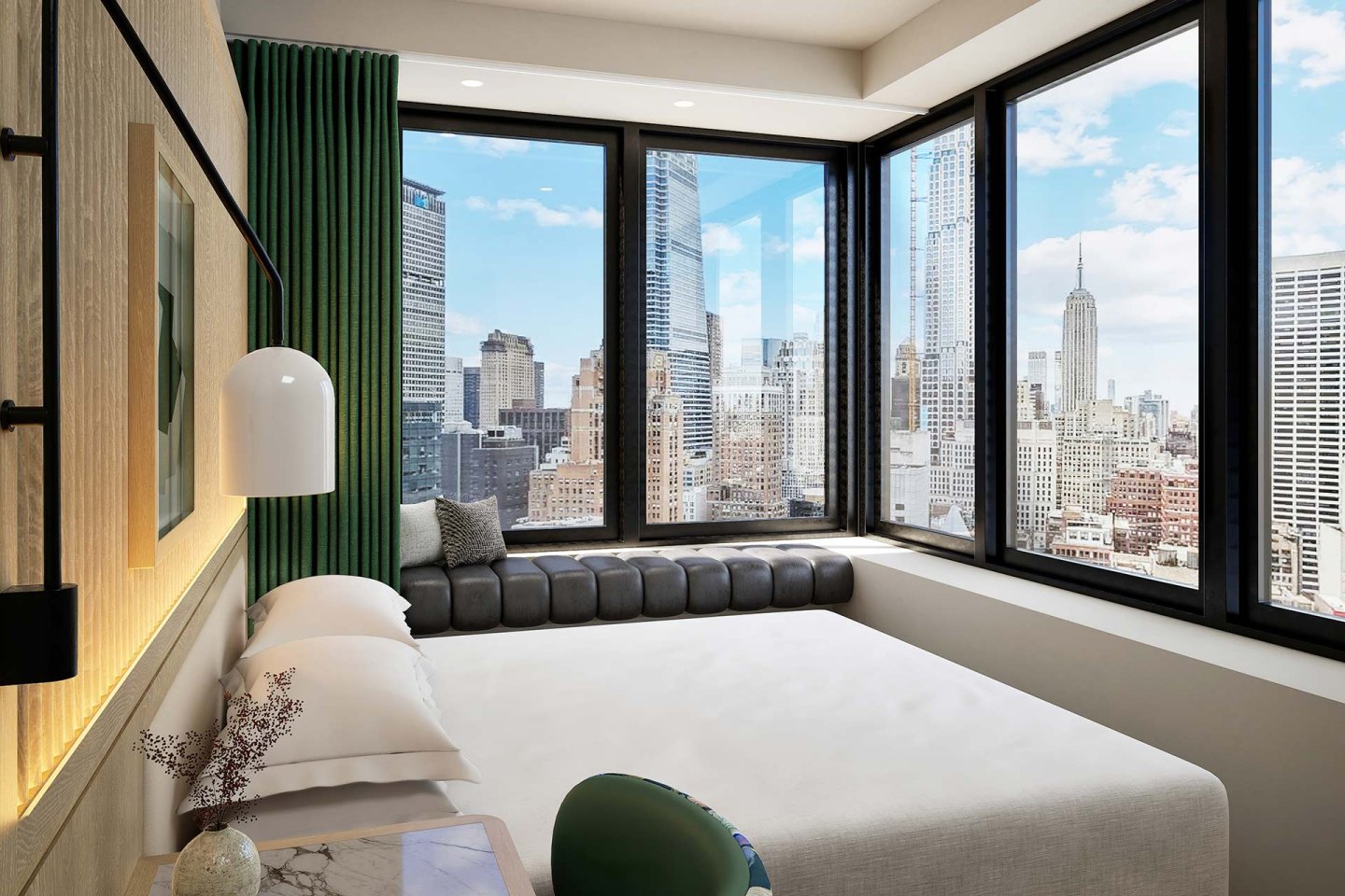 A bedroom with a large window overlooking a city.