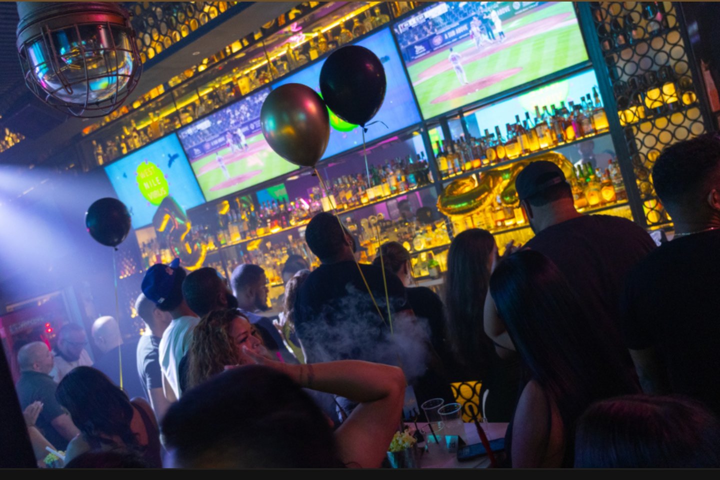 Nightlife crowd watching sports at Dive Bar LIC