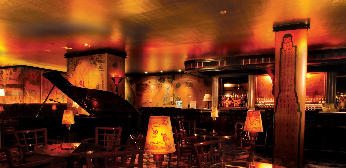 Piano and interior of Bemelmans Bar at The Carlyle, A Rosewood Hotel, Upper East Side, NYC
