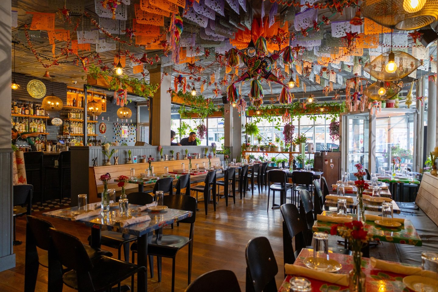 Modern Mexican restaurant interior with colorful decorations and an open dining space.