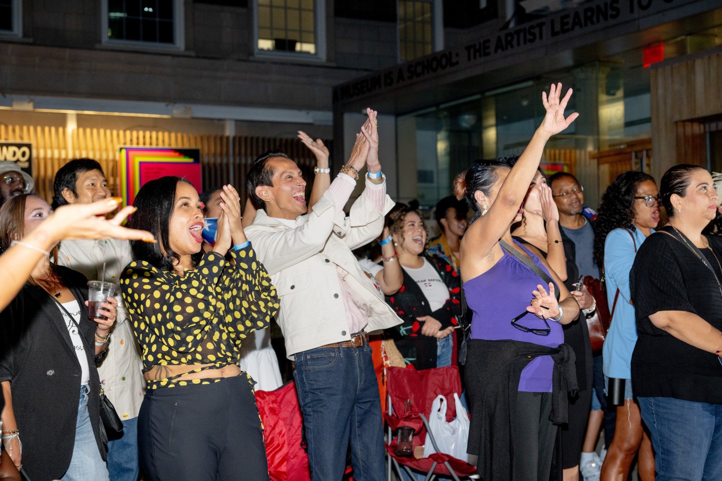 People cheering at night