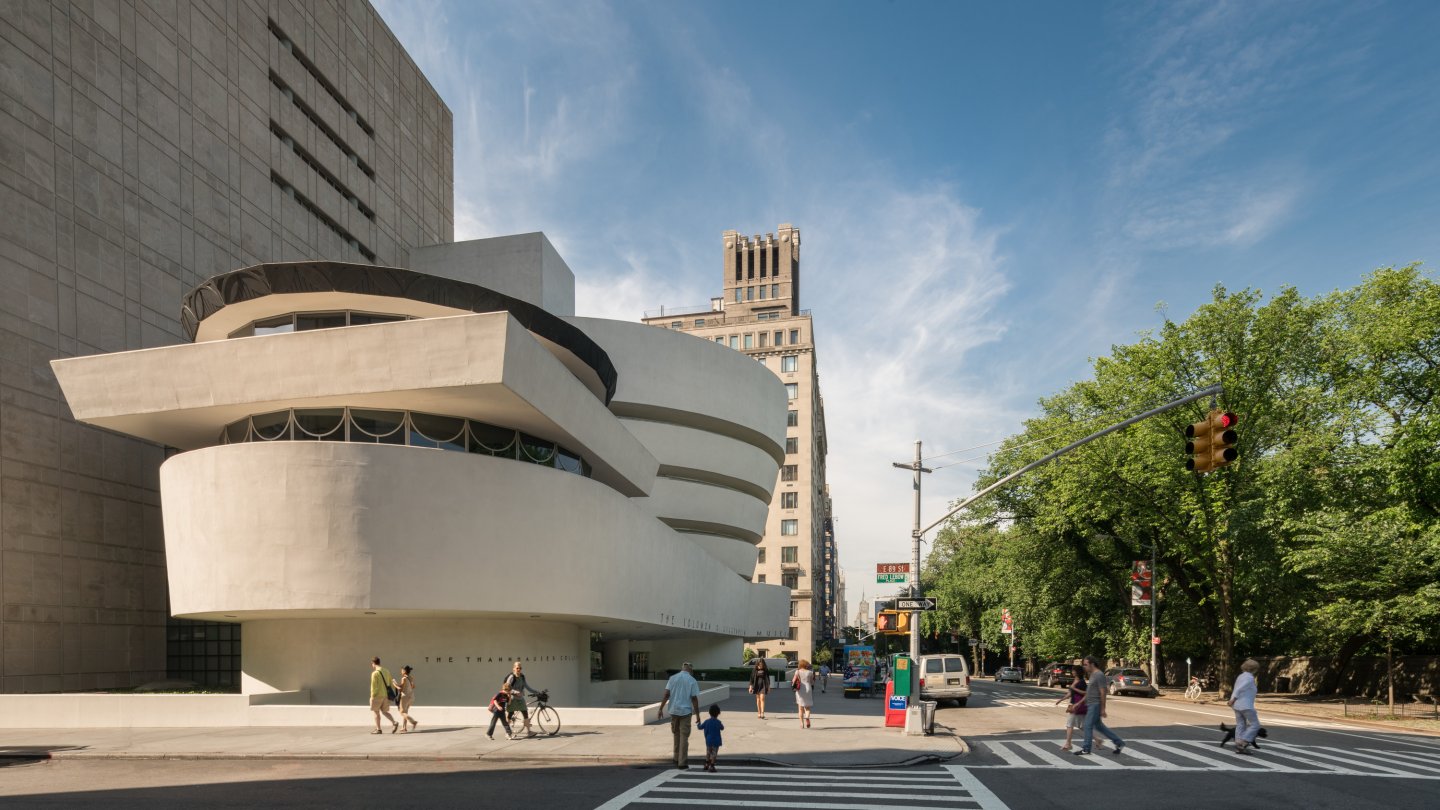 Exterior of the Guggenheim New York with people walking by