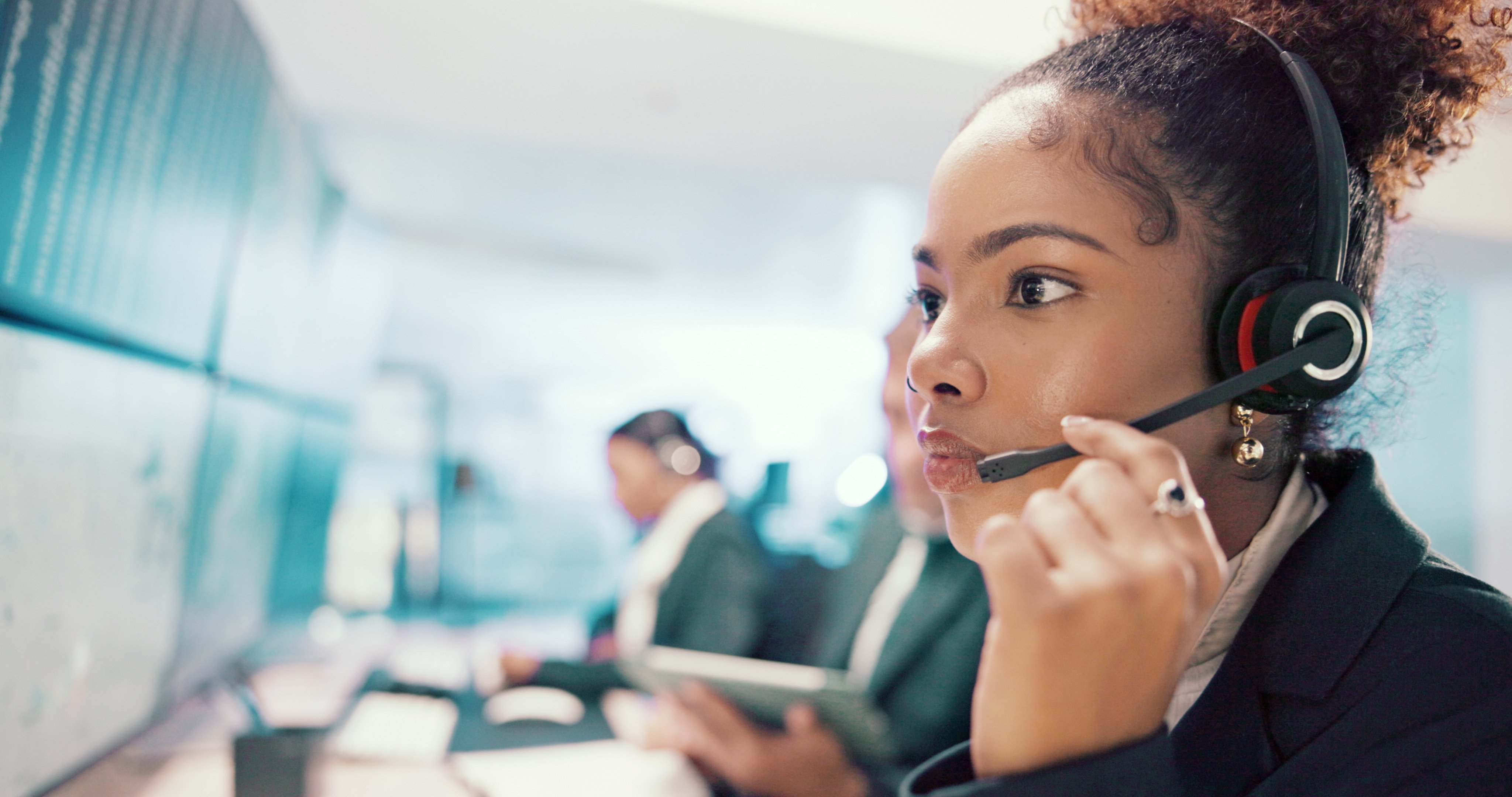 Emergency, service and woman on computer with headset for security, dispatcher and operator. Telecommunication, surveillance and first responder with monitor for incident report, contact and help.